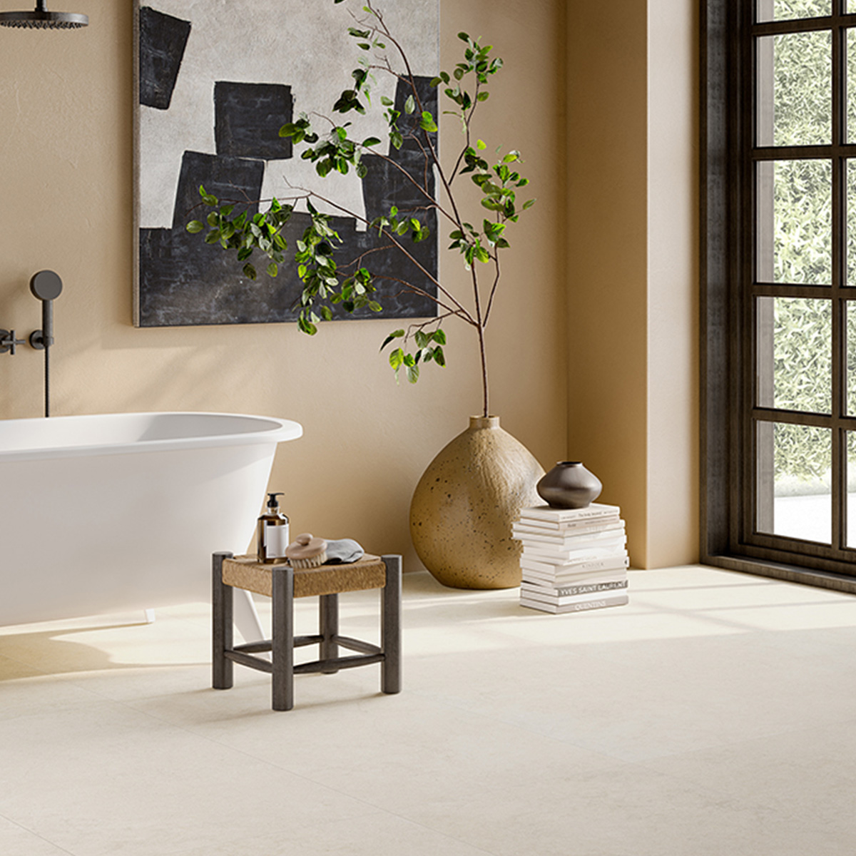 A modern bathroom featuring the Lutezia - Beige freestanding tub, complemented by wall art, a potted plant in a large vase, a small stool with a pump bottle, stacked books, and large windows that fill the space with natural light.
