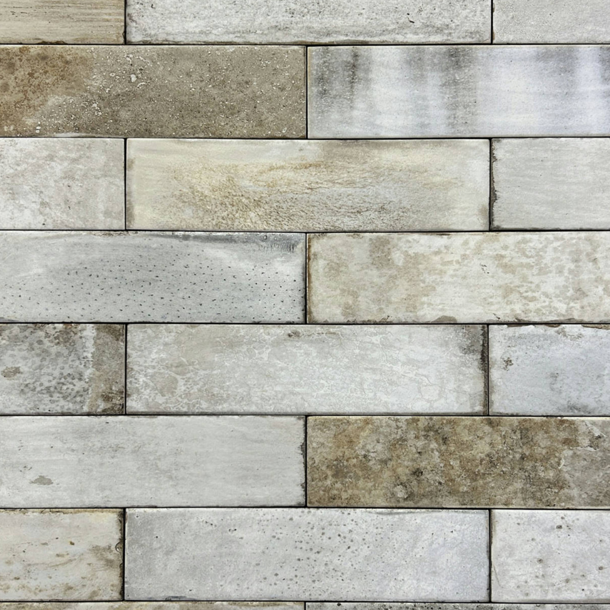 Pals tiles are rectangular stone tiles arranged in a staggered pattern, featuring various shades of gray, beige, and white with natural textures and patterns visible on the surface.