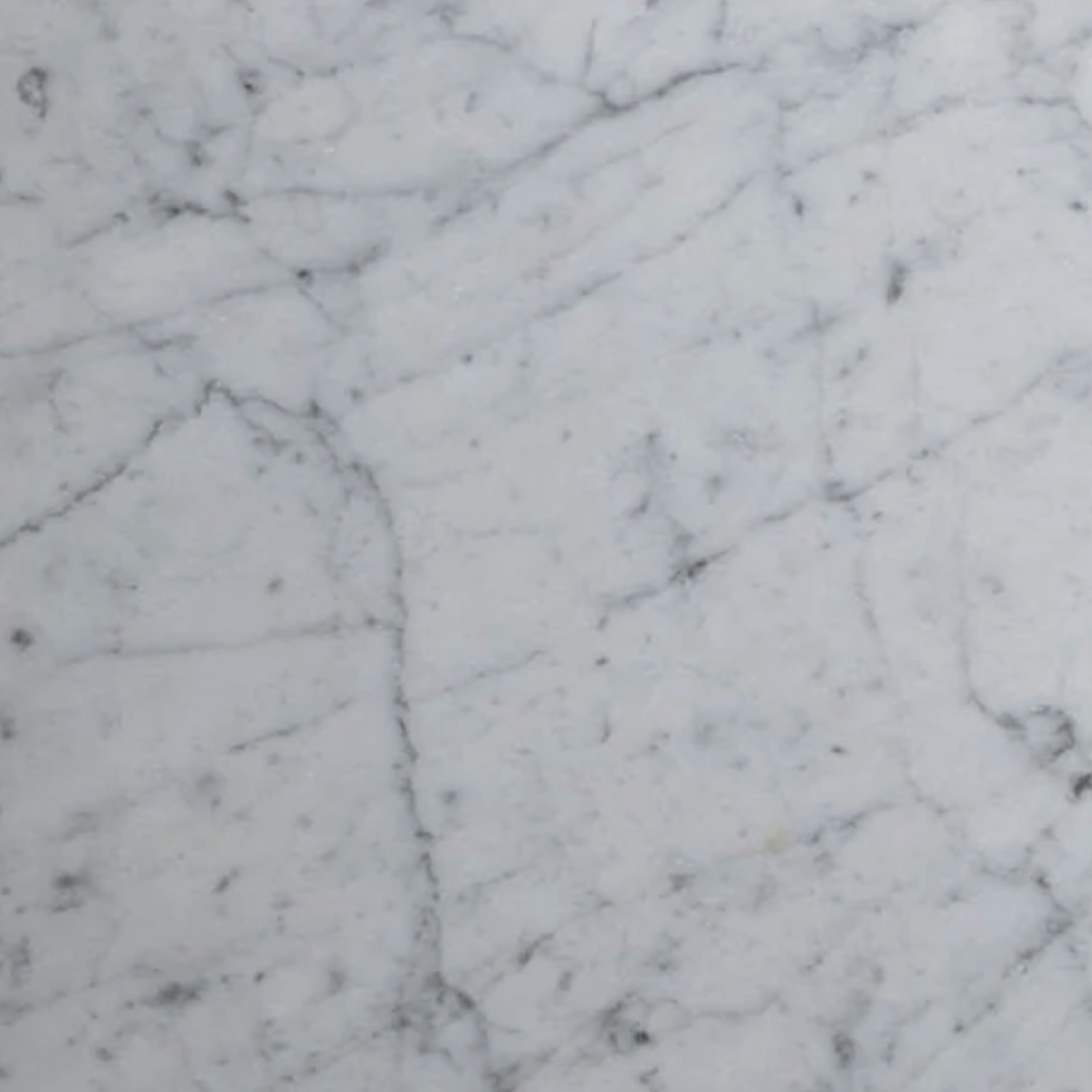 Venatino Carrara Bath Accessories (Bevel Seat) feature a white marble surface with light grey and dark grey veins running in various directions, creating a natural, textured pattern characteristic of marble stone.