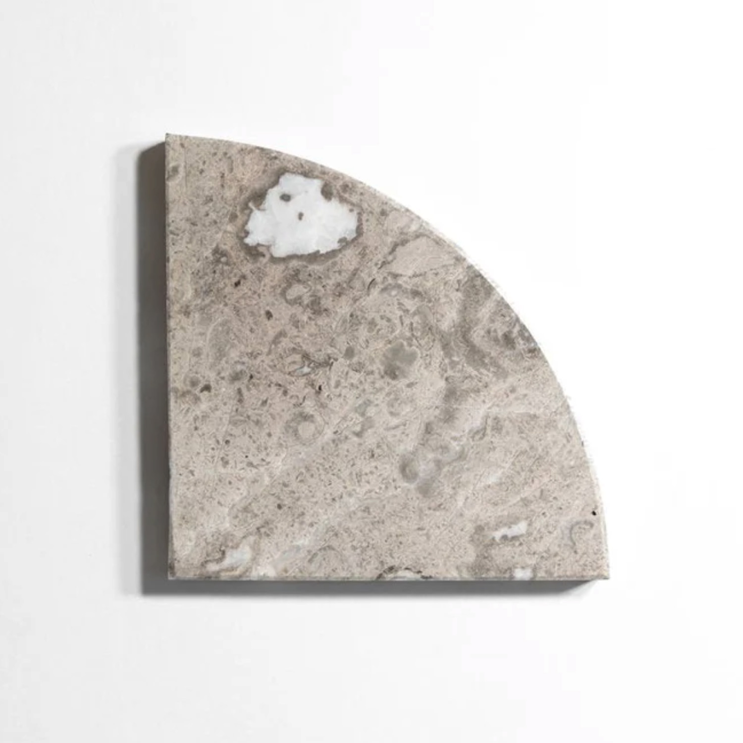 A quarter-circle Sage Gray corner shelf from the Bath Accessories collection, crafted in light gray marble featuring natural irregular patterns and a small white patch, displayed on a plain white background.