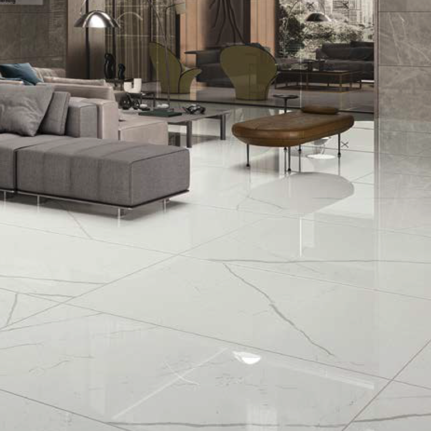 Modern living room featuring a gray sectional sofa, a wooden coffee table, and spacious floors finished in Beyond Calacatta - Classic White tiles. A glass wall divides the area, while outdoor greenery is visible through expansive windows.