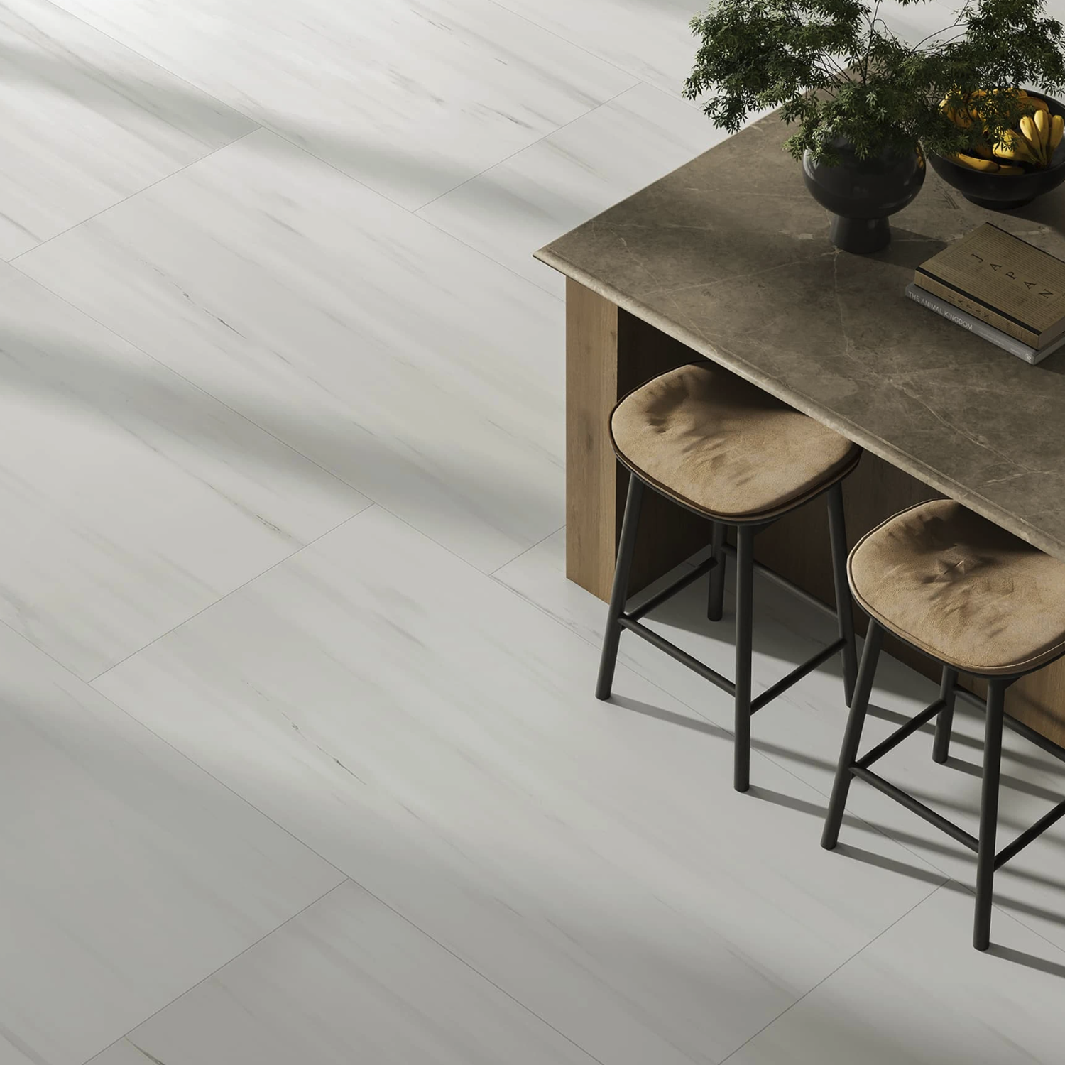 A Beyond Dolomite - Gray tiled floor is paired with a wooden table, accompanied by two cushioned barstools. On the table rest a potted plant, two books, and a black bowl. Natural light brightens the setting.