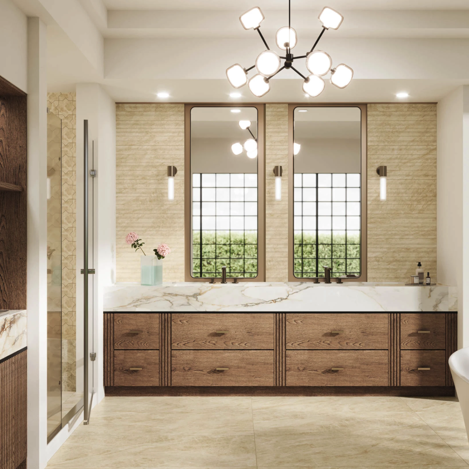 Modern bathroom featuring double sinks, wooden cabinets, large mirrors, a Beyond Taj Mahal - Champagne countertop, a vase with pink flowers, and a geometric chandelier. Natural light streams in from grid windows above greenery outside.