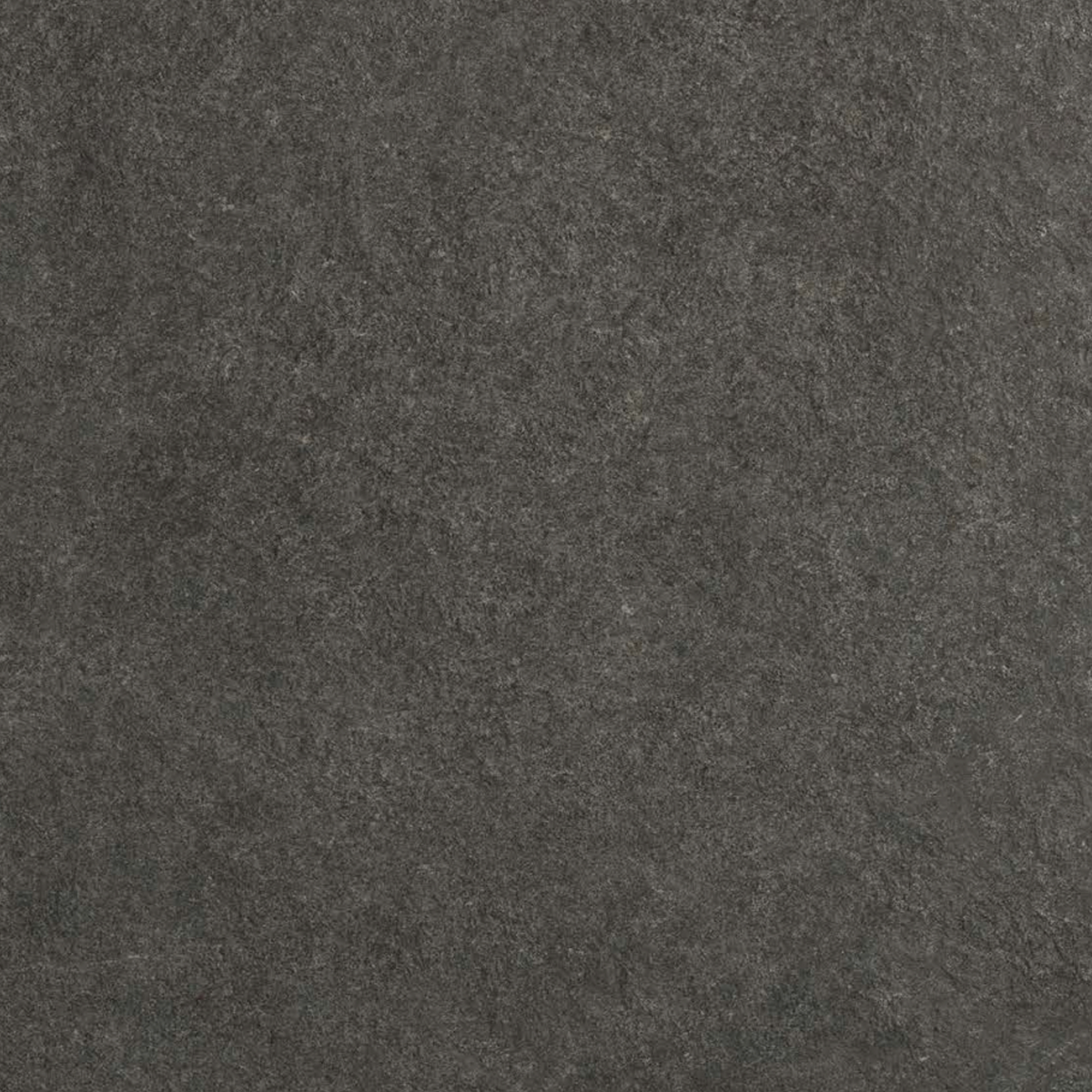 Close-up view of Boost Mineral - Tarmac, featuring a dark, textured surface with a slightly rough and uneven appearance reminiscent of black stone or concrete.