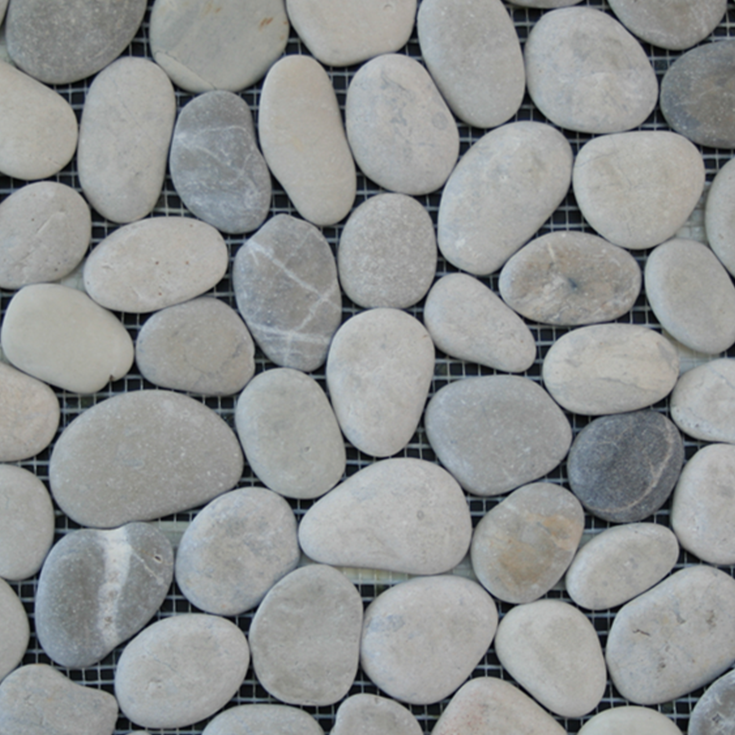 A top-down view of Botany Bay - Shadow Sliced, featuring smooth, oval gray and beige river stones arranged on a wire mesh grid.