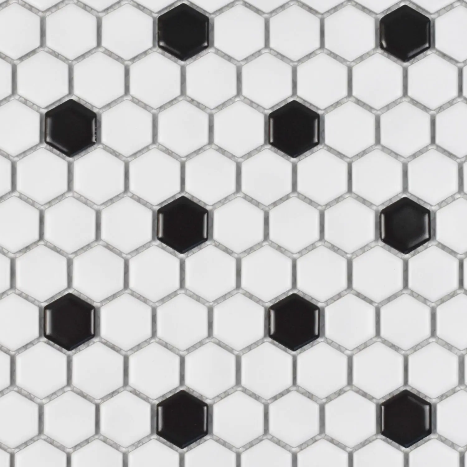 CC Mosaics - White/Black tiles feature a white hexagonal design with randomly distributed black hexagons, producing a striking contrasting pattern. The grout lines distinctly outline each tile, resulting in a uniform honeycomb effect.