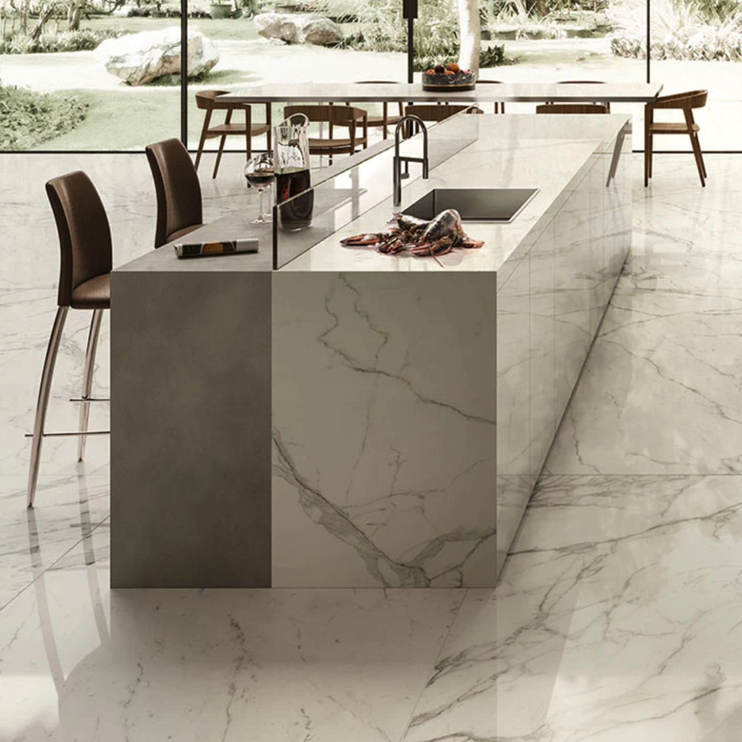 Modern kitchen featuring a Calacatta Extra A marble island, brown chairs, glassware, a decanter, and an outdoor view with greenery visible through expansive windows. The Calacatta Extra A marble flooring matches the island for a cohesive look.