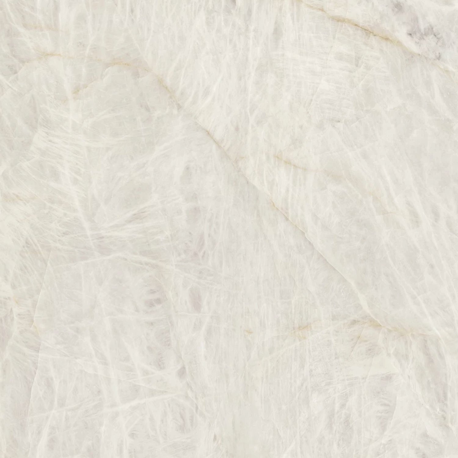 Crystal White Bookmatch features a light beige marble surface adorned with subtle white and gray veining, creating a soft, natural texture throughout the stone. The pattern is delicate and slightly cloudy in appearance.