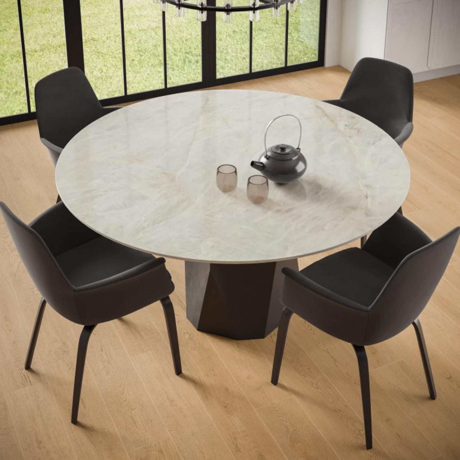 A round table crafted from Crystal White Bookmatch is set with a black teapot and two cups, surrounded by four black chairs on a light wooden floor, with large windows in the background.