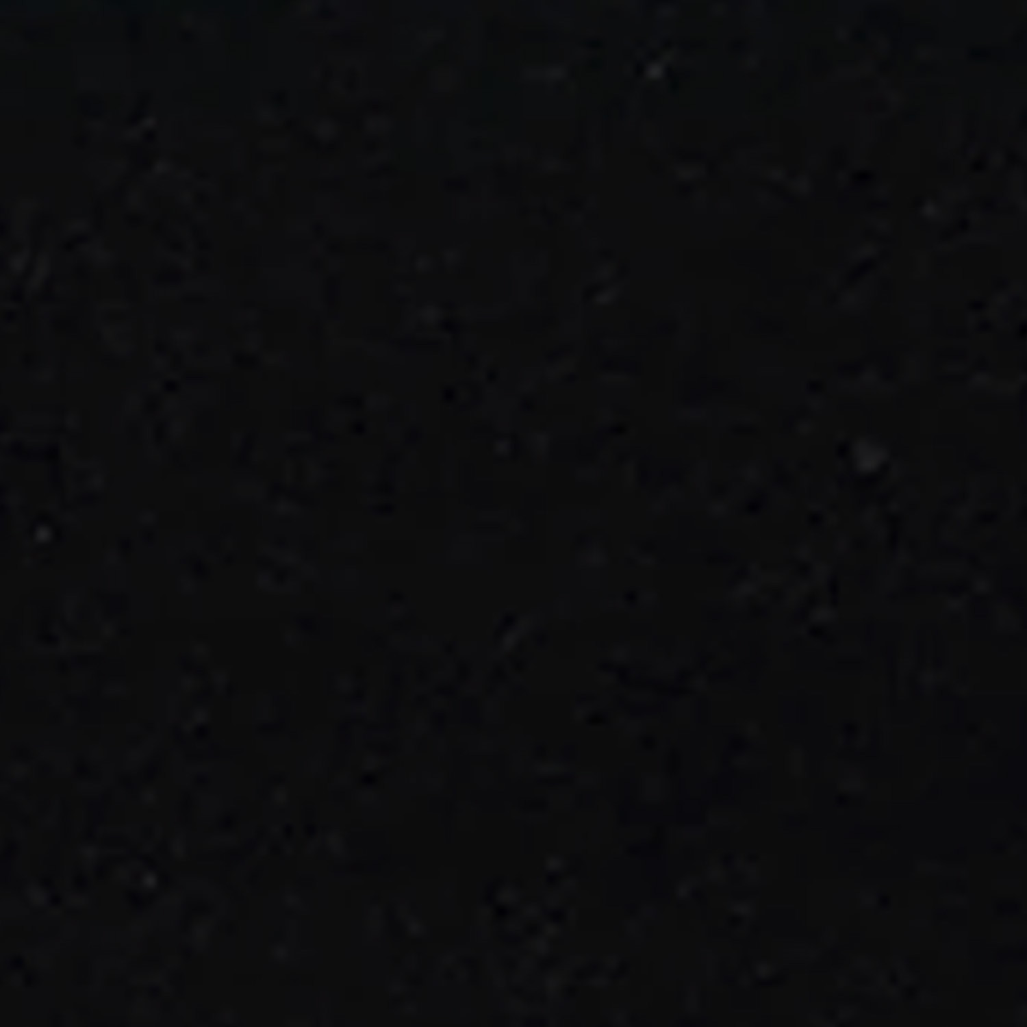 A solid black surface with a slightly grainy texture, characteristic of Curbs - Black, with no distinguishable shapes or objects visible.