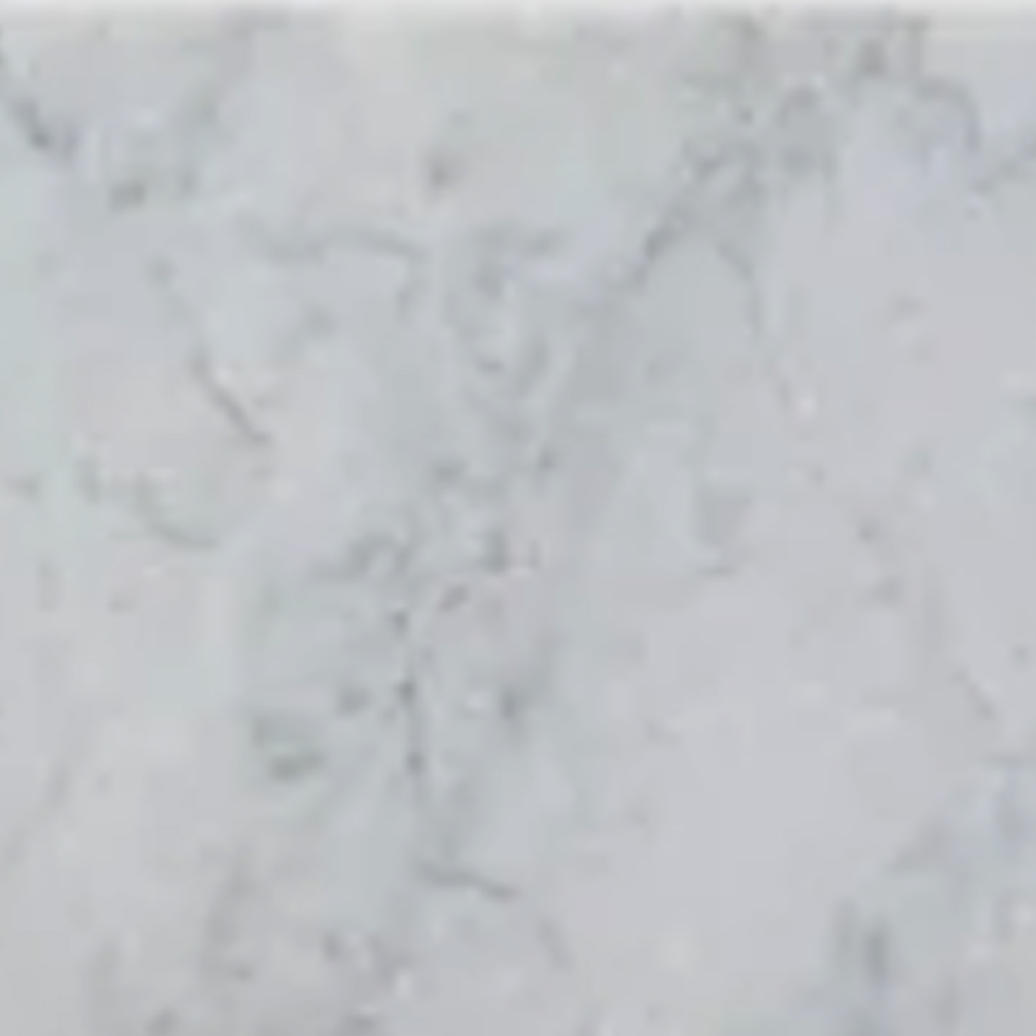 Close-up of Curbs - Venatino Carrara, featuring a light gray marble surface with subtle, natural veining and a smooth texture.