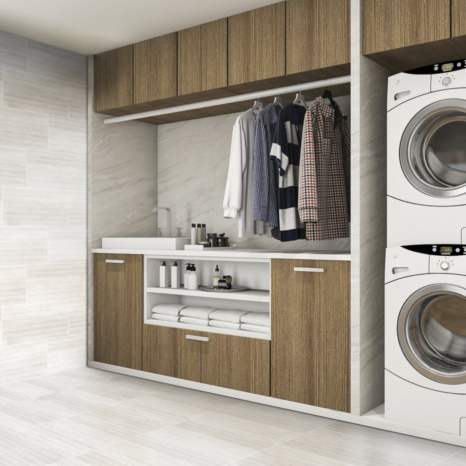 Modern laundry room featuring wood cabinets, a countertop, neatly folded towels, cleaning supplies, shirts hanging on a rod, and a stacked front-loading washer and dryer. The walls and floor are finished with Ecocrete - Melted Ice tiles for a fresh, clean look.