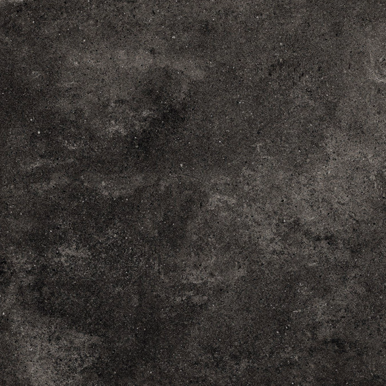 Ecocrete - Weathered Black features a rough, dark gray stone surface with subtle shade variations and scattered small speckles throughout.