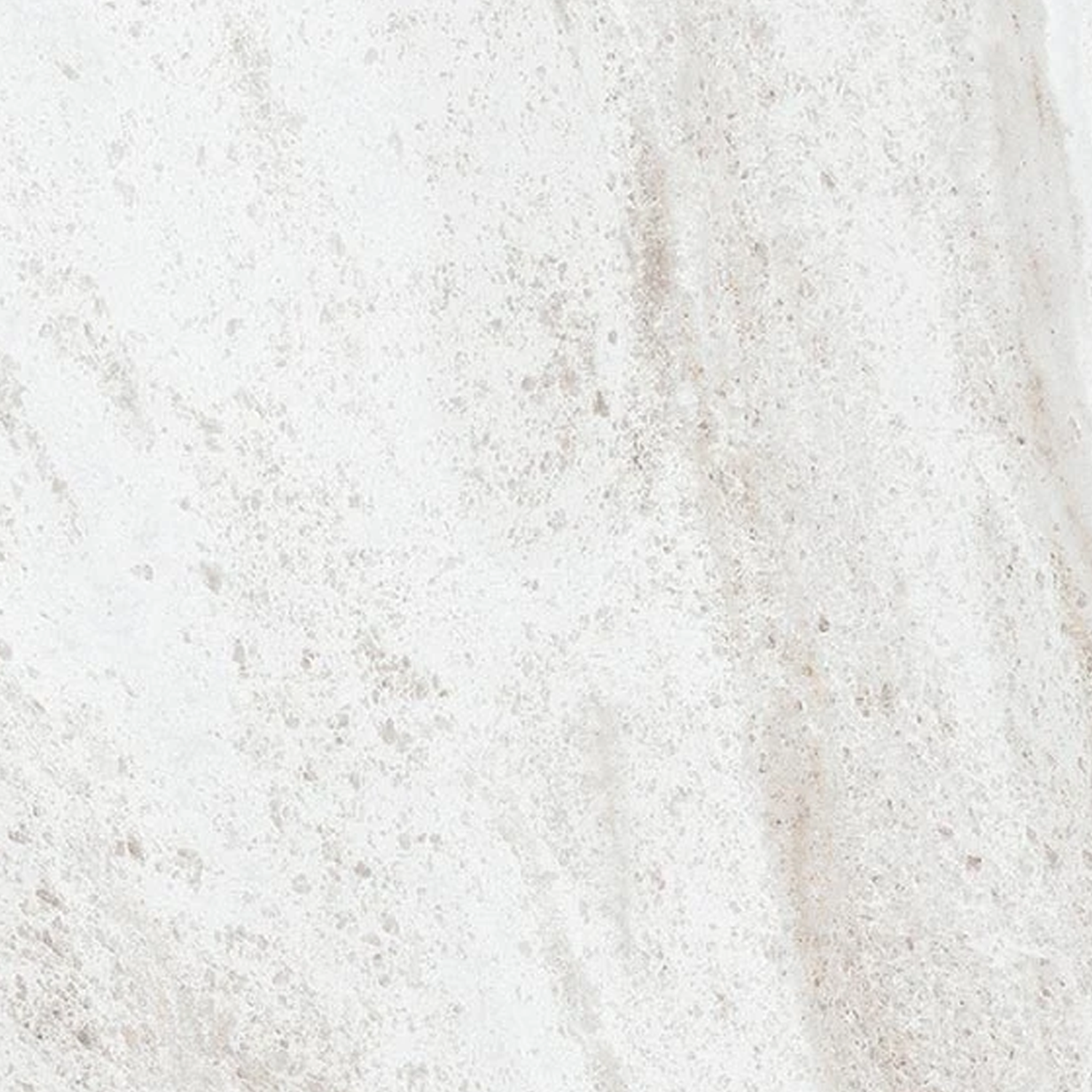 Eon - Eldorado features a white marble surface adorned with subtle gray and beige veining, offering a natural, elegant, and smooth stone look.