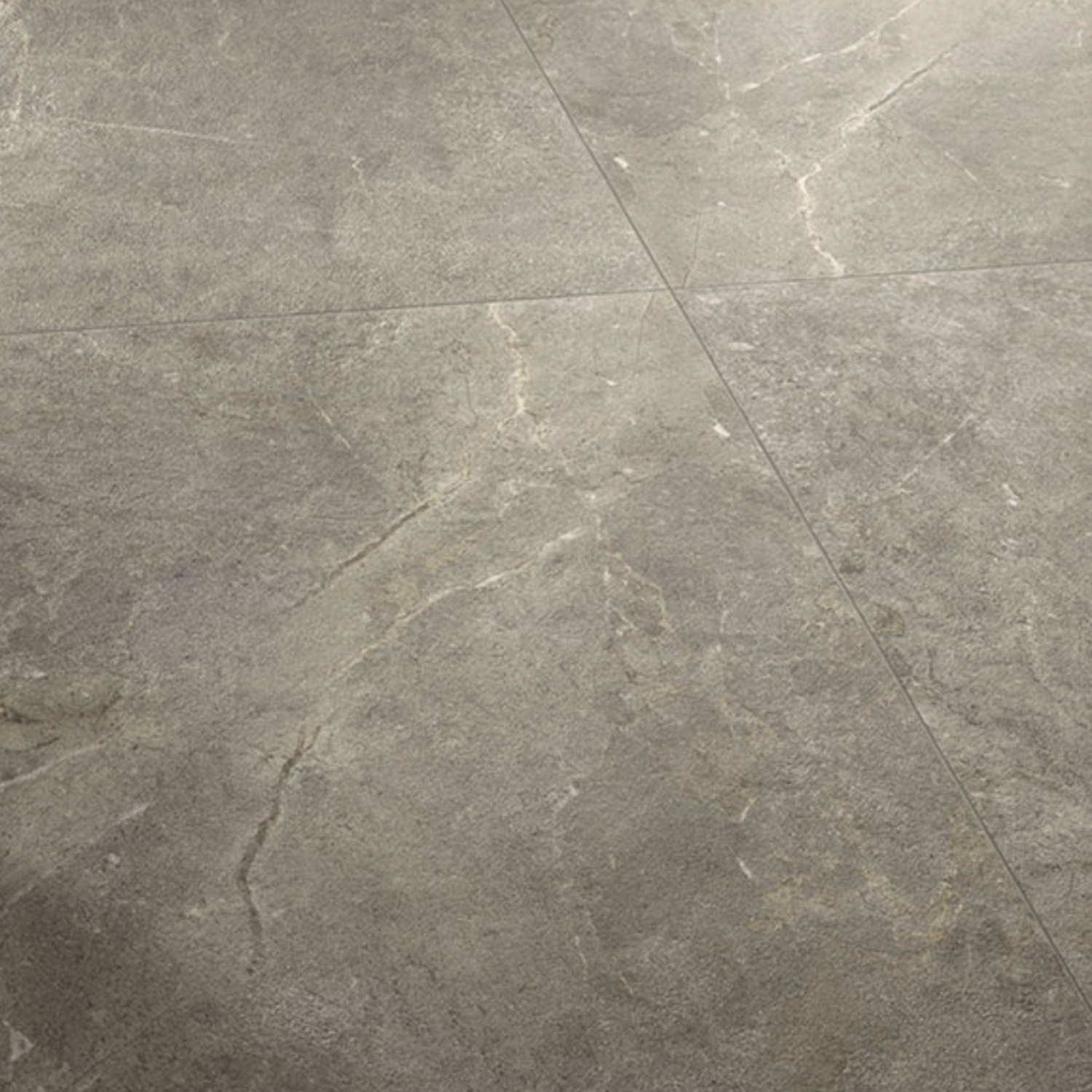 Close-up of Everstone - Ever Brown floor tiles featuring gray tones with subtle white and beige veining, arranged in a square pattern. The slightly textured matte surface adds to their natural stone appearance.