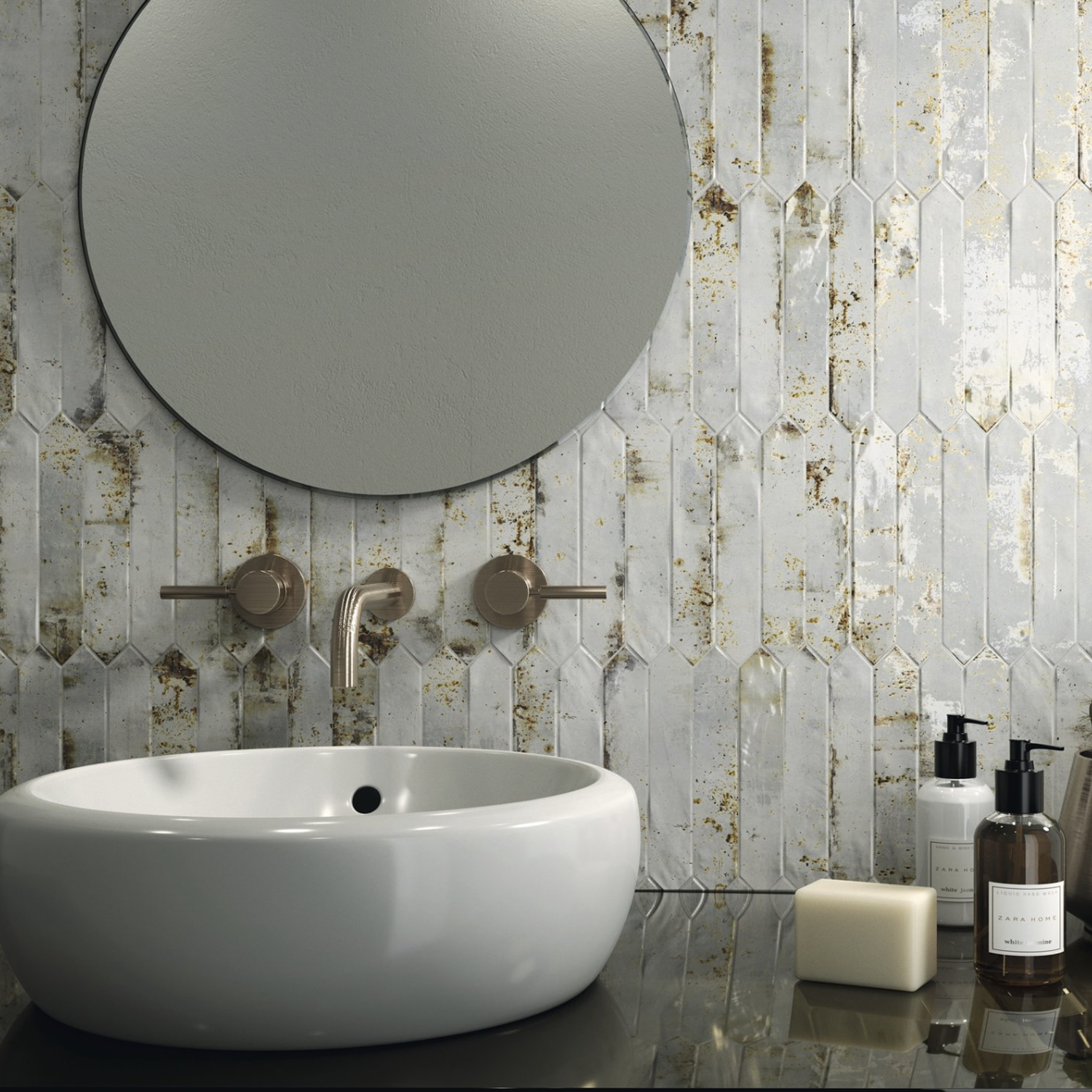 Modern bathroom featuring a round mirror, oval white sink, wall-mounted faucet, and Grunge - Oxide decorative tiles. Soap, pump bottles, and a bar of soap are placed on the glossy countertop beside the sink.