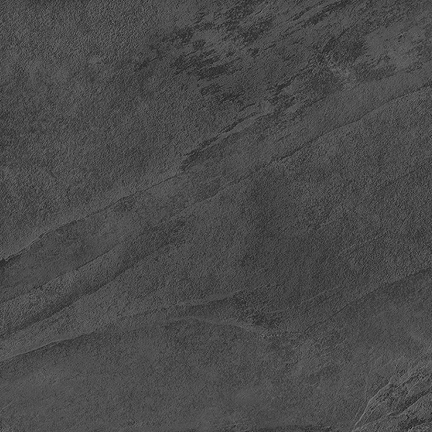 Sure! Here’s a rewritten description using the product name "Hero - Coal": Hero - Coal features a dark gray, textured stone surface with subtle natural patterns and faint lines reminiscent of slate or concrete. Its varying shades and roughness create a rugged and organic look throughout, adding character to any space.