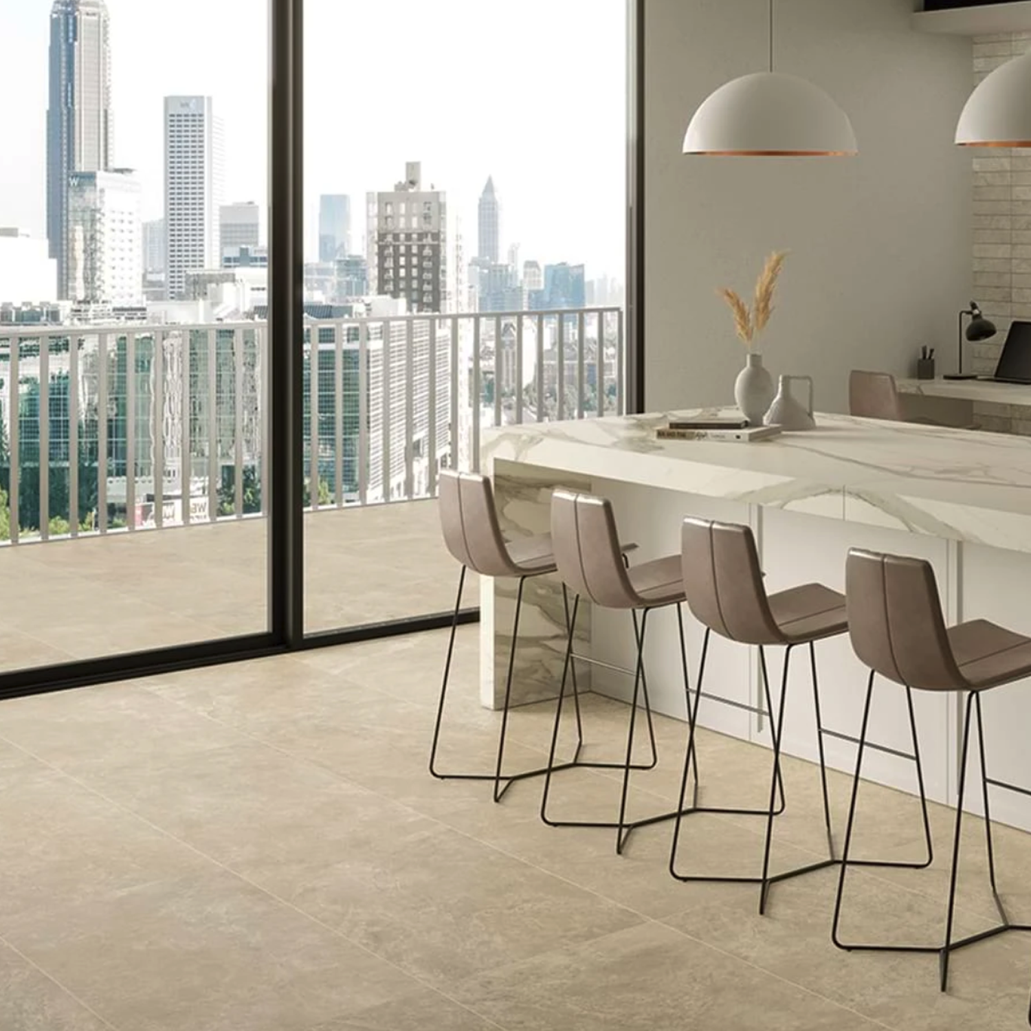 A modern kitchen featuring the Hero - Cord pendant lights hanging above a marble island with brown barstools, large windows showcasing a city skyline, and beige floor tiles.