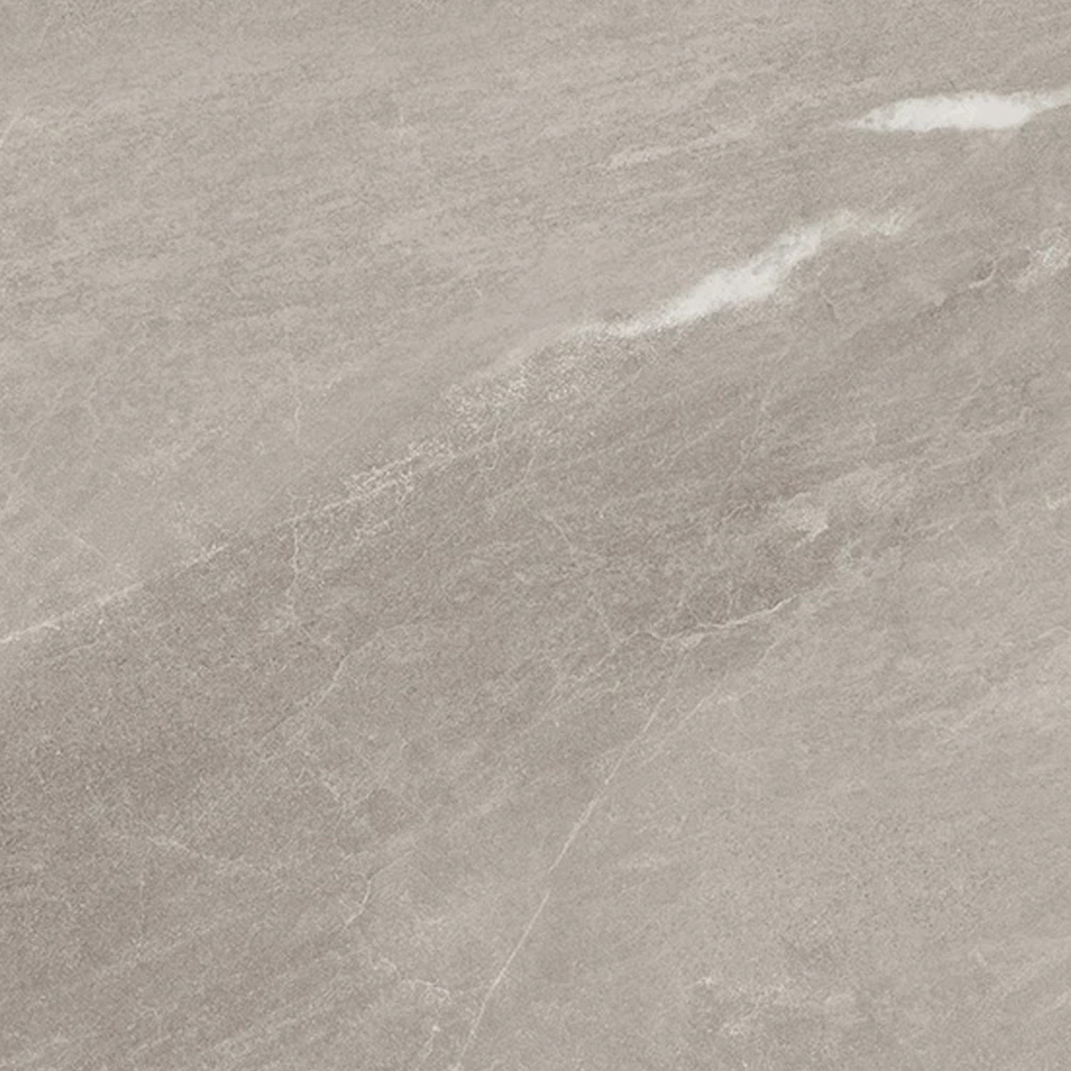 A close-up of Legacy Marblestone - Dove showcasing its light gray, textured stone surface with subtle white streaks and fine natural veining running across it.