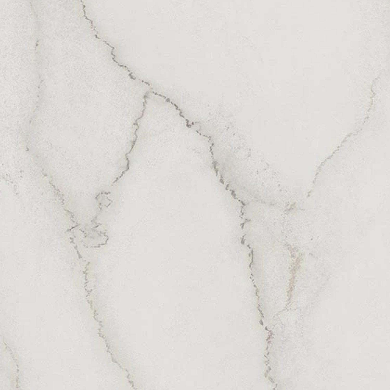 Liberty - Calacatta Centennial features a white marble surface with subtle gray veining and natural, irregular patterns running diagonally across the stone. The smooth texture gives it an elegant and classic look.