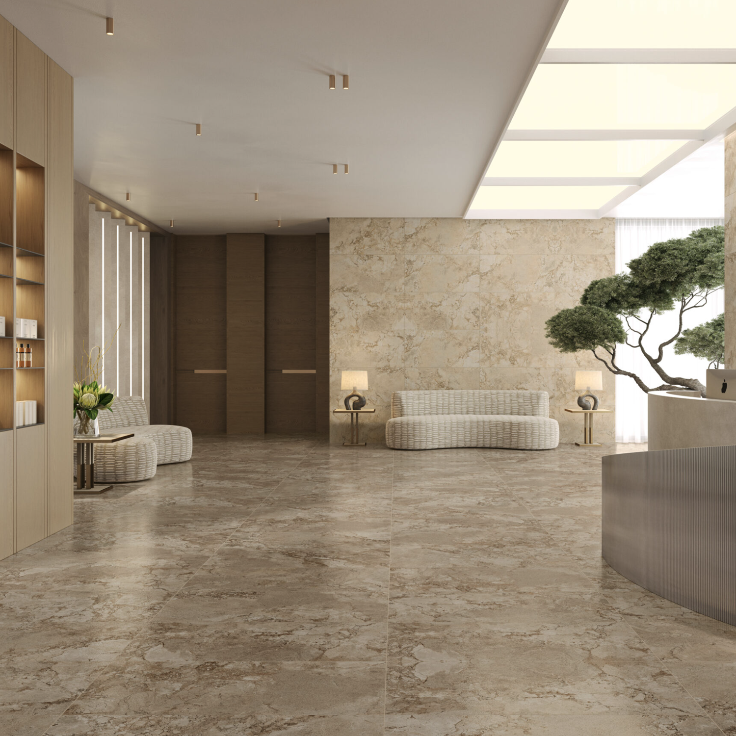 Spacious, modern lobby featuring Lythos - Clay marble floors, beige textured walls, minimalist furniture, potted plant, built-in shelves, and soft lighting from ceiling fixtures and large windows.