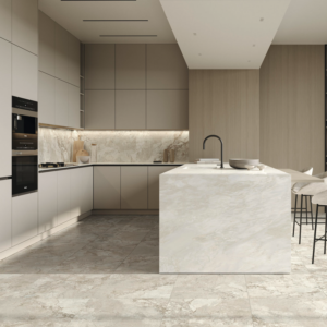Contemporary kitchen featuring beige and gray cabinetry, Lythos - Snow marble backsplash and countertops, built-in ovens, a spacious island with integrated sink and seating, all styled in neutral tones. The design is clean, open, and minimalist throughout.