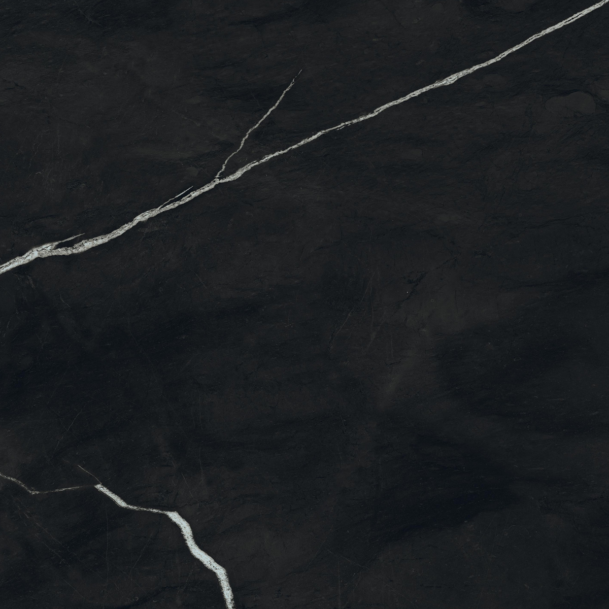 Marvel Meraviglia - Black Origin features a striking black marble surface with subtle white veining that runs diagonally, creating an elegant and natural pattern against its dark, textured background.