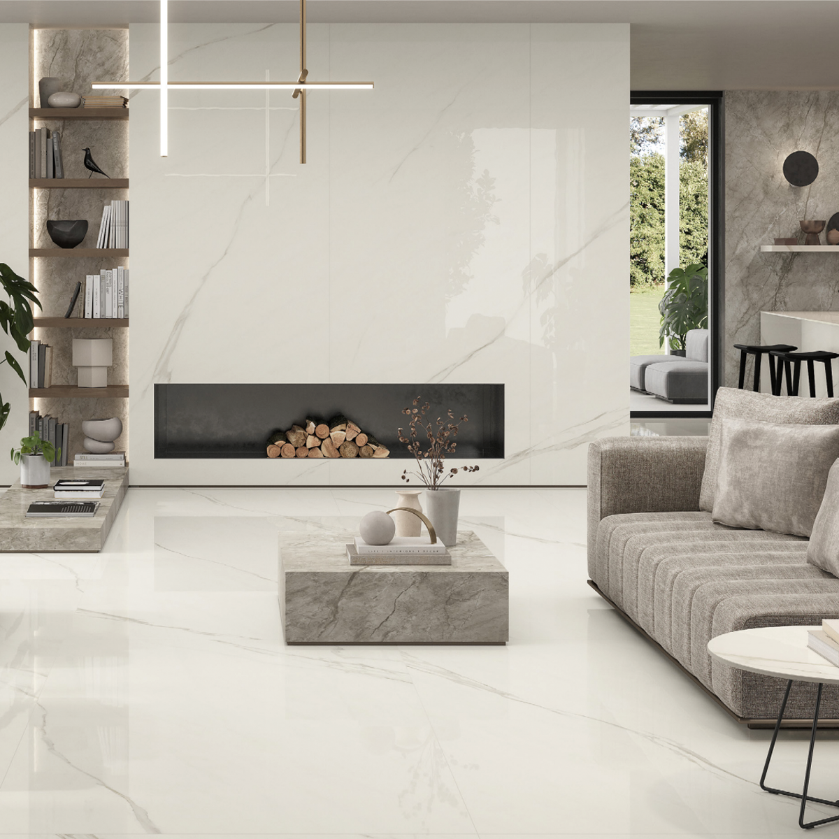 Modern living room featuring Marvel Meraviglia - Calacatta Meraviglia marble floors and walls, a sleek fireplace, gray sectional sofa, minimalist coffee table, and decorative plants. Large windows fill the space with natural light.