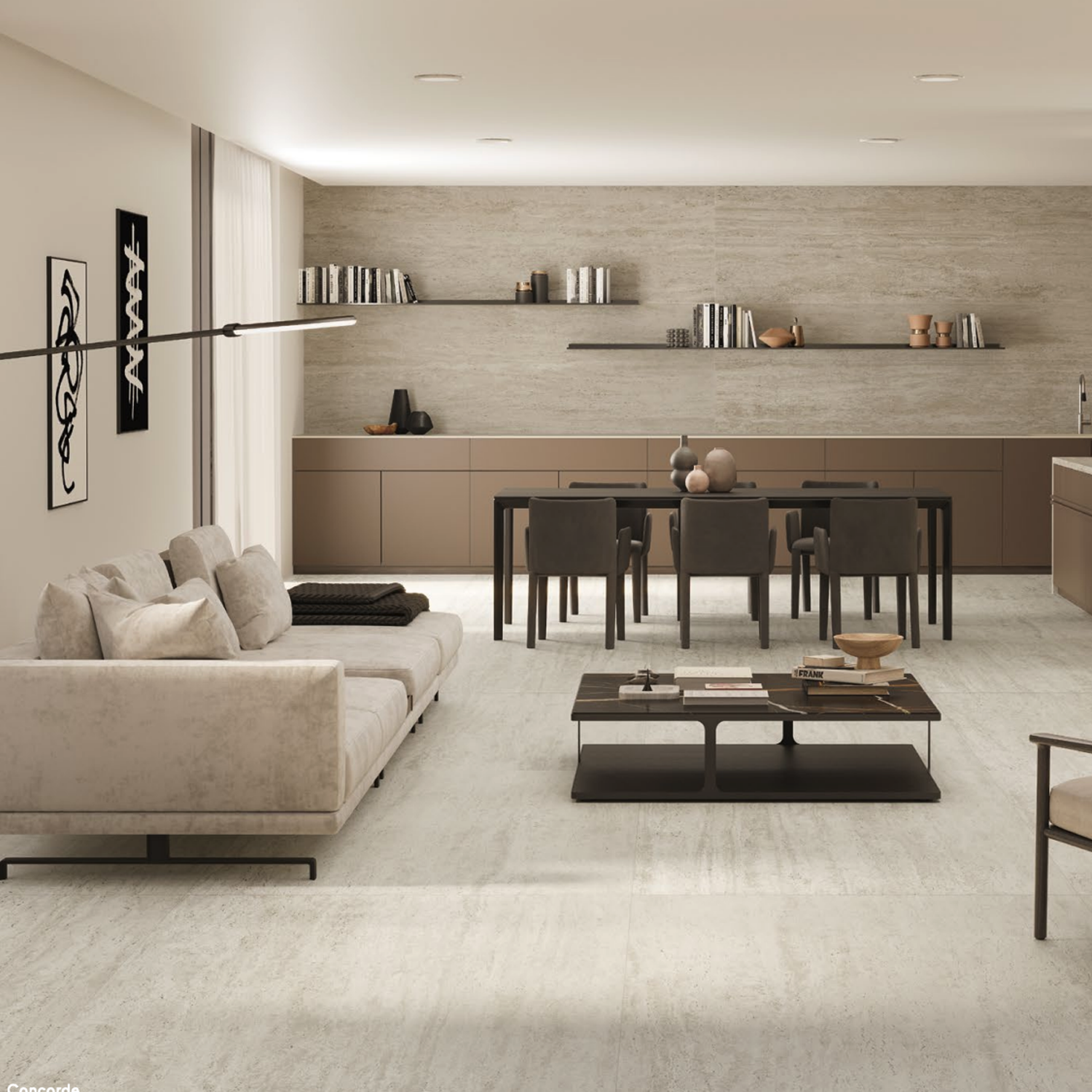 Experience modern living and dining in a neutral-toned space featuring the Marvel Travertine - White Vein Cut as a sophisticated backdrop. The area includes a beige sofa, coffee table, dining table with chairs, wall shelves adorned with books and decor, and minimalistic wall art. Large windows fill the room with natural light.