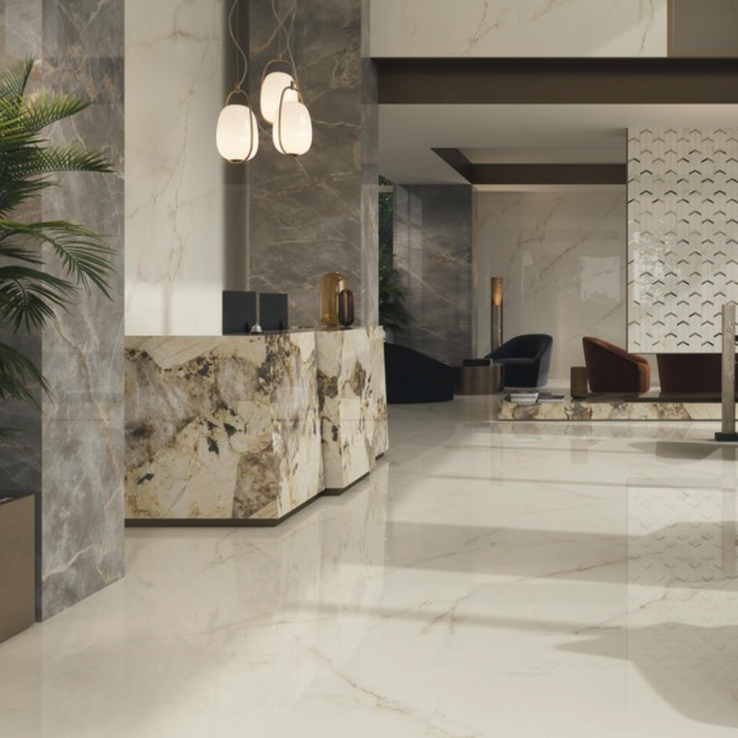 The lobby features Marvel X - Calacatta Apuano glossy marble floors and walls, complemented by a matching marble reception desk, stylish pendant lights, lush plants, and contemporary chairs in the background, creating a luxurious and elegant atmosphere.