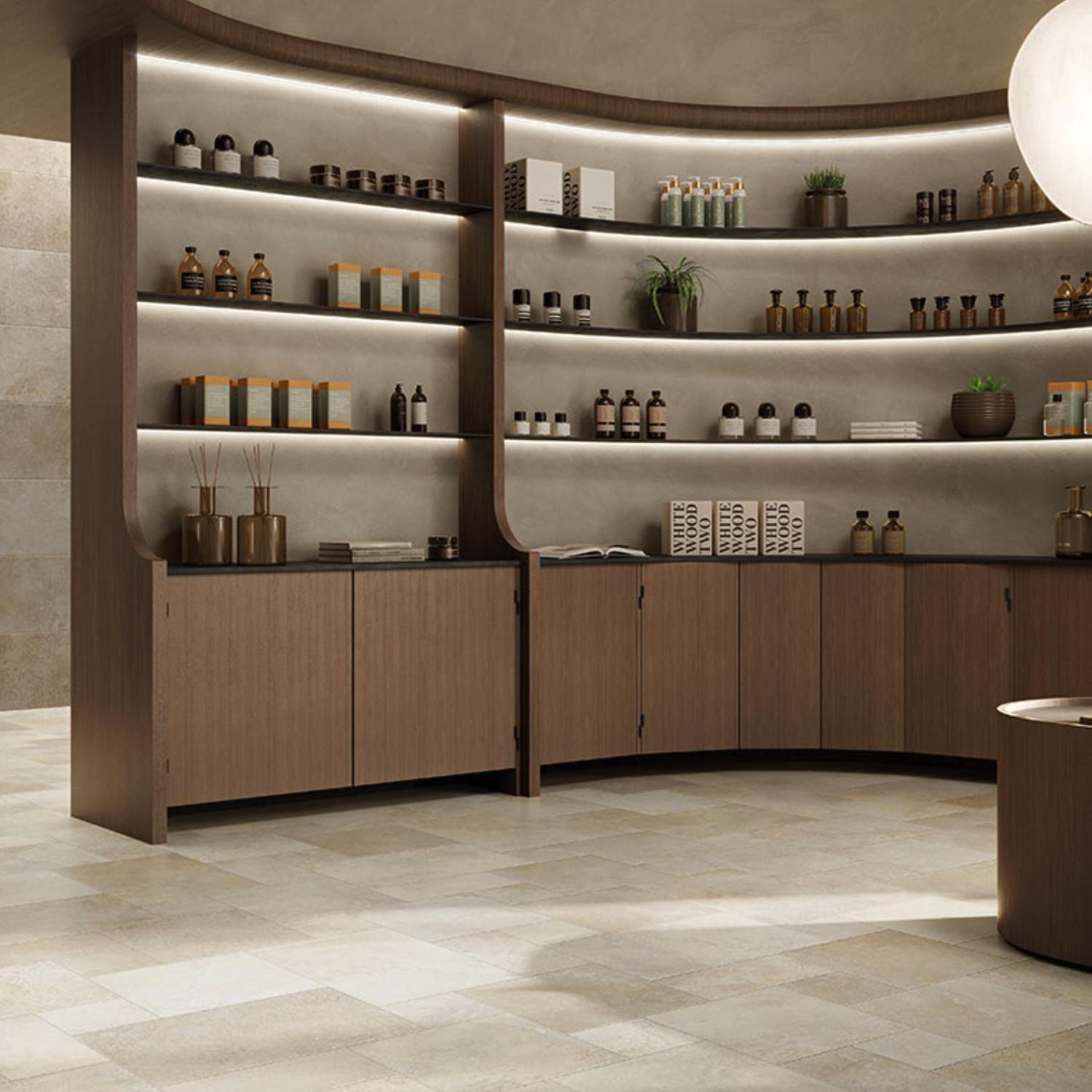 The Molo Audace - Terra D'Ormeggio, a contemporary curved wooden shelving unit, elegantly showcases bottles, boxes, and plants. Featuring backlit shelves and complemented by neutral stone floors and walls, the space exudes a minimalist, spa-inspired ambiance.