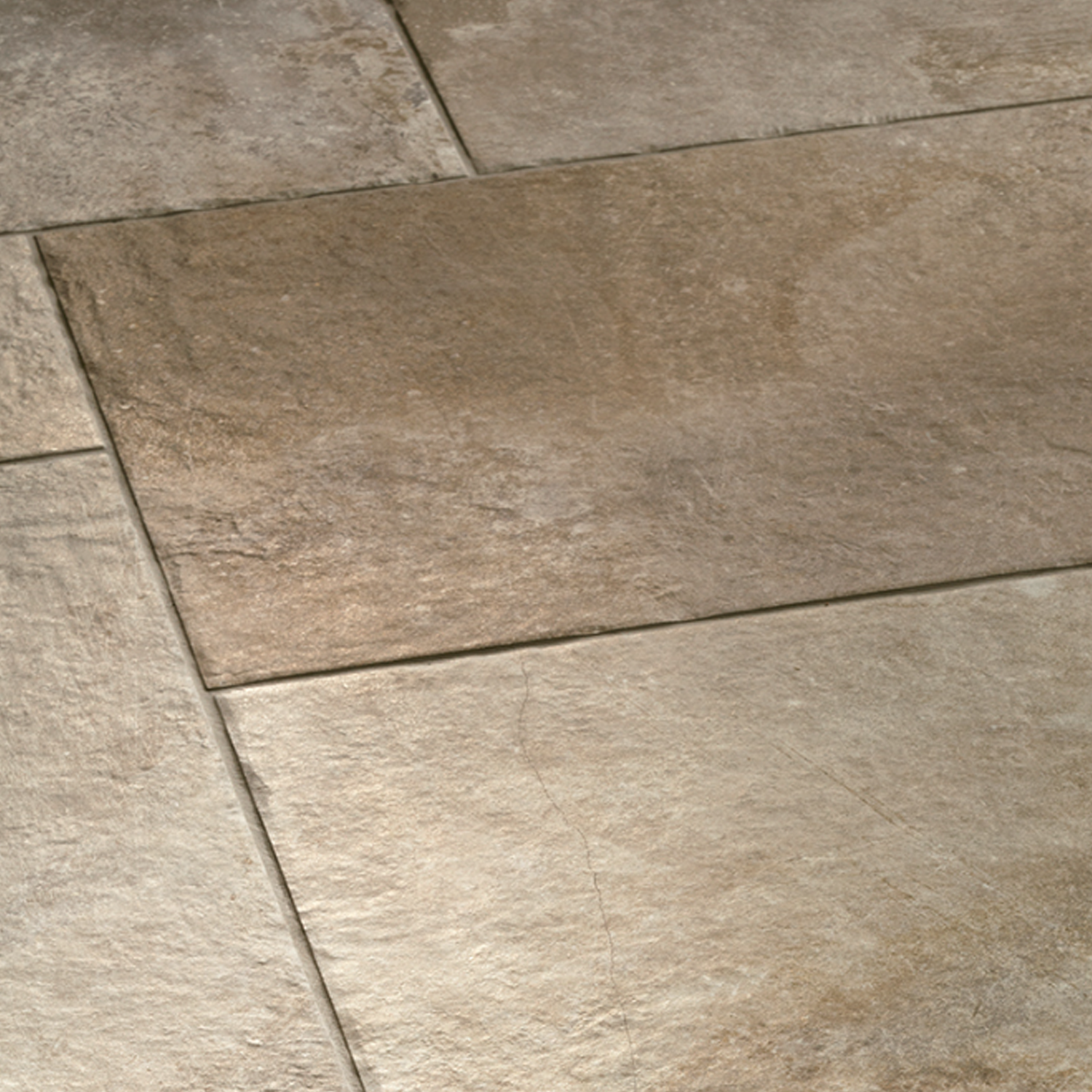 Close-up of Molo Audace - Terra D'Ormeggio tiles in beige and light brown, arranged in a staggered pattern with textured surfaces and visible grout lines.