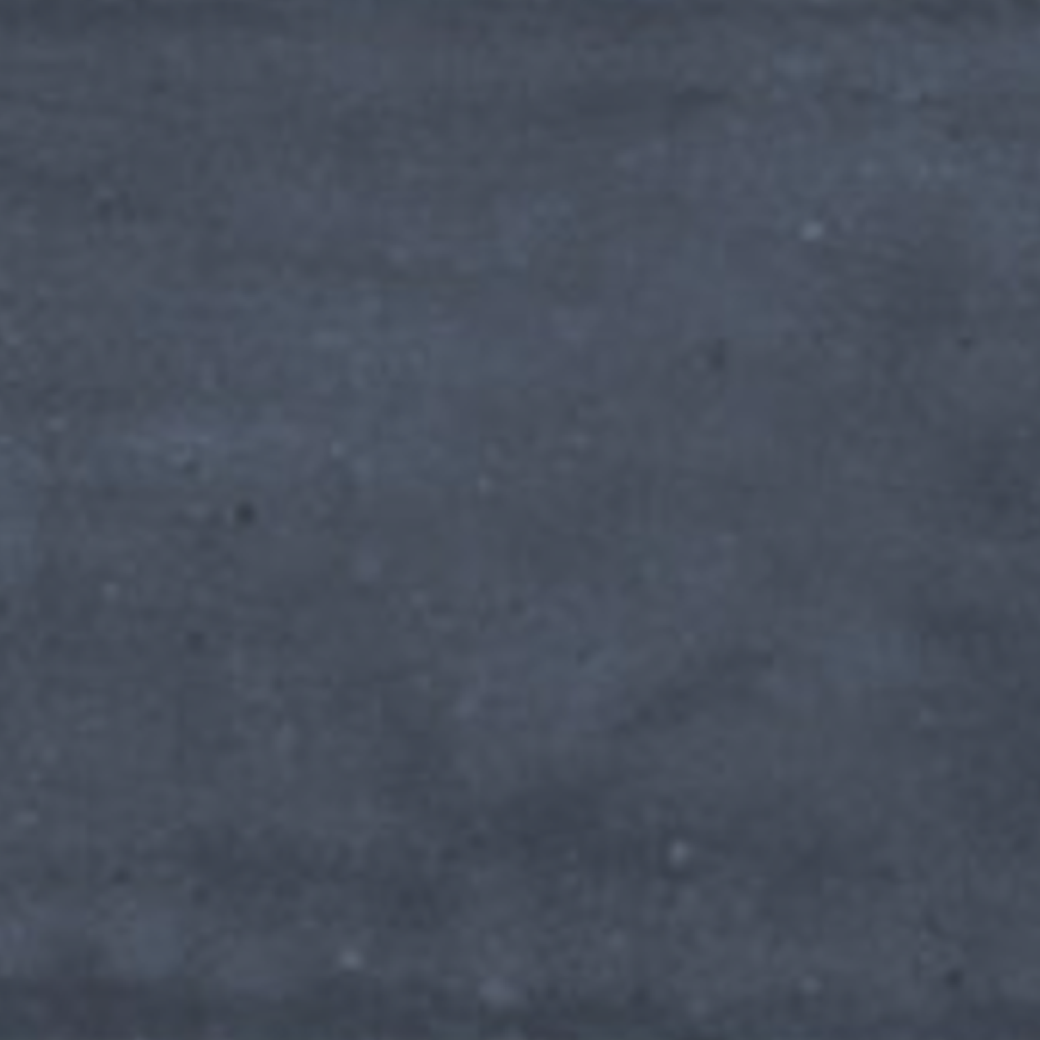 A close-up of the Pim Pam Pum - Pum Blue surface, showcasing its textured dark blue finish with subtle color variations and small light specks scattered throughout.