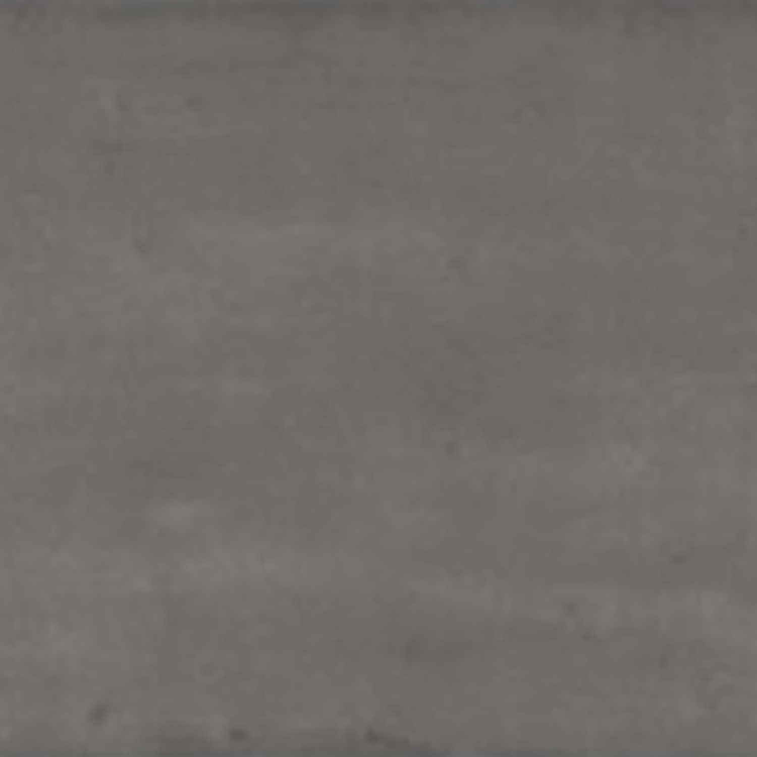 A close-up view of Pim Pam Pum - Pum Grey showcases its textured gray surface with horizontal streaks and shading variations, resembling slate or concrete.