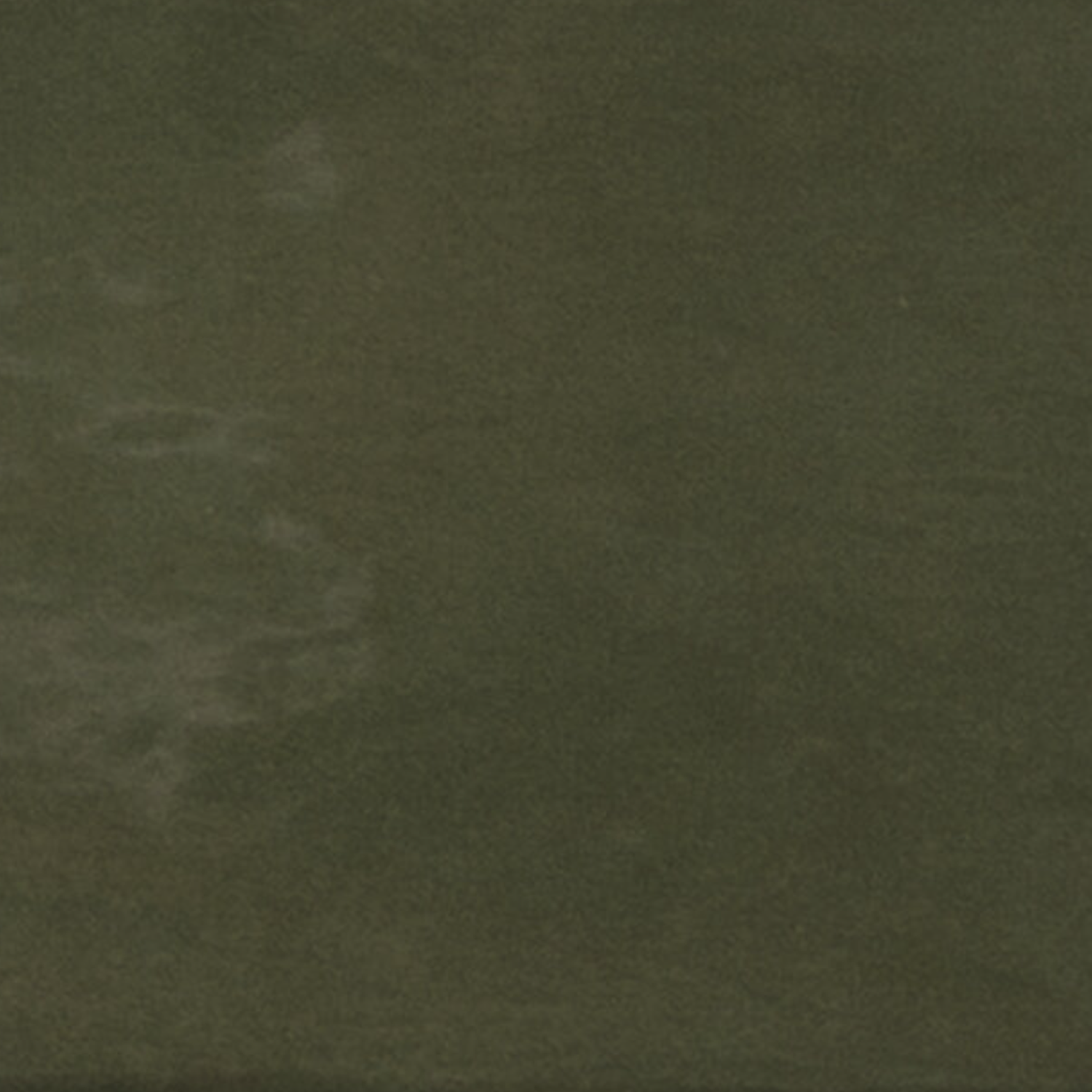 A close-up of Seville - Green showcases its dark, textured surface with subtle lighter patches and irregular patterns, reminiscent of stone or concrete.