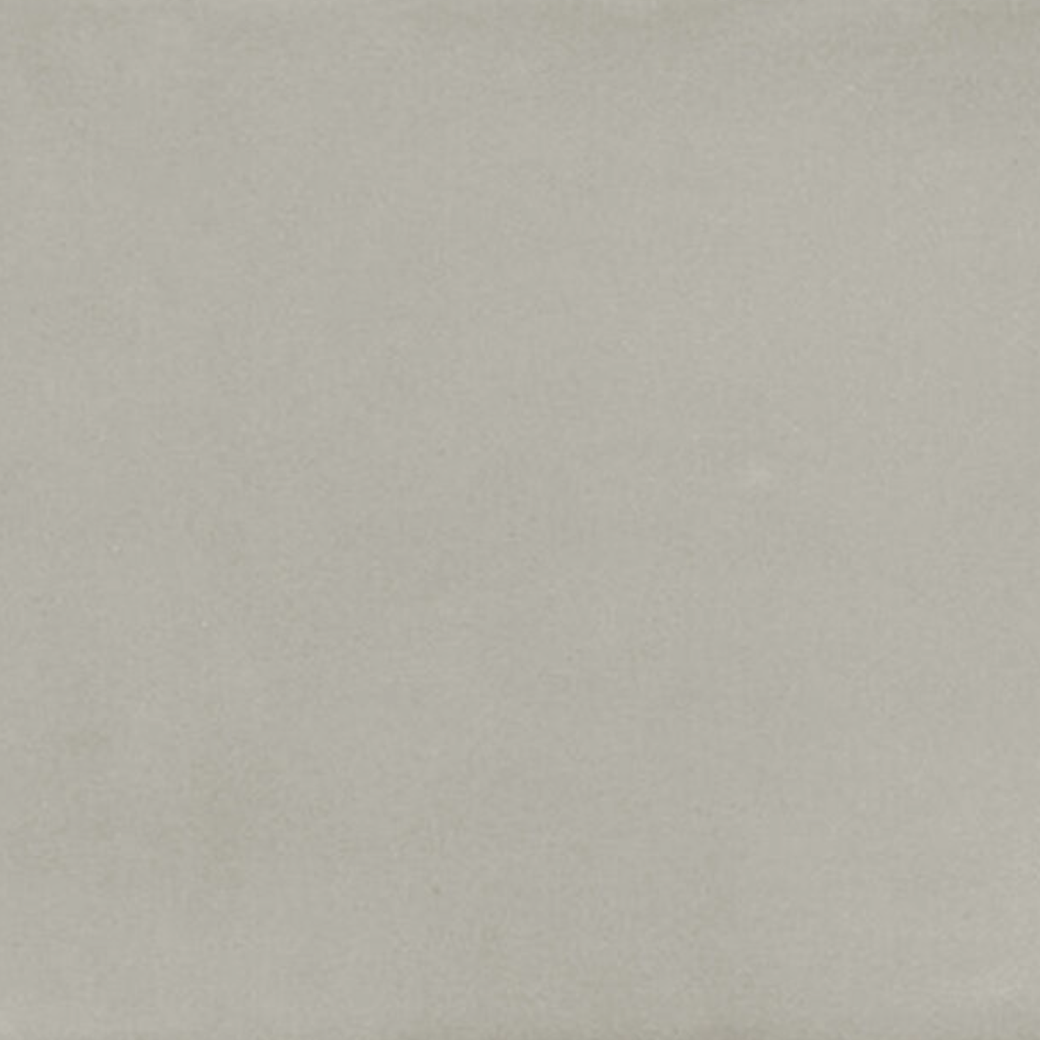 A plain, light gray textured surface from the Seville - Grey collection, resembling stone or concrete with subtle shading and no distinct patterns or markings.