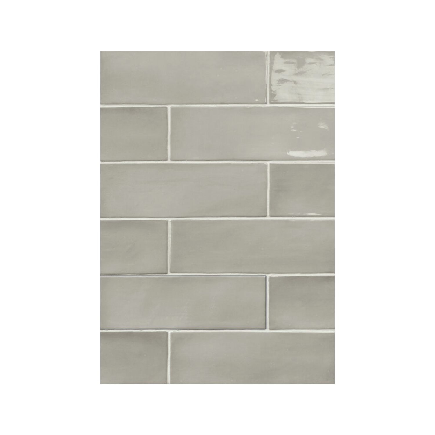 Seville - Grey rectangular tiles in light gray, featuring a mix of matte and subtly glossy finishes, are arranged in a horizontal offset (subway) pattern.