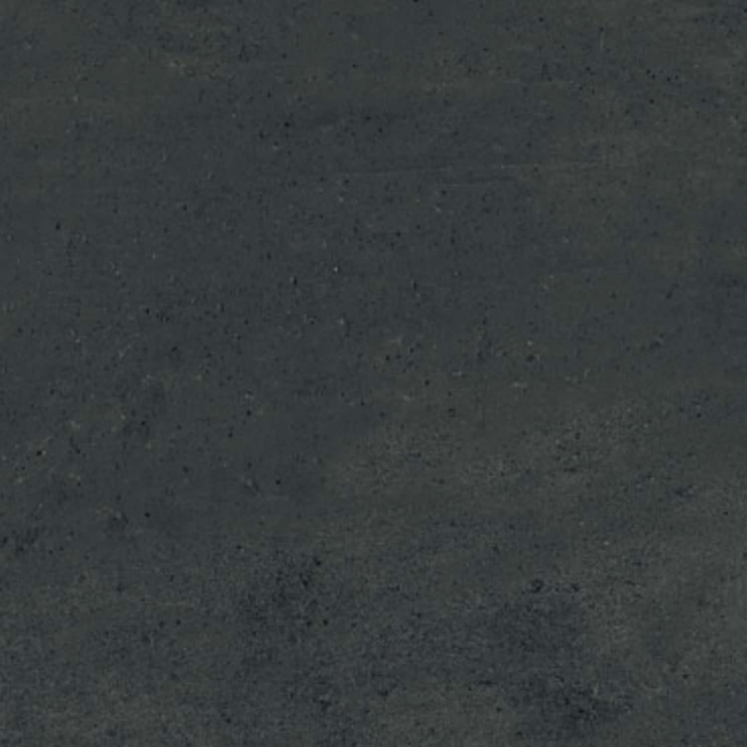 A dark, textured surface from the Simply Modern - Black collection, resembling black concrete or asphalt with subtle color variations and faint speckles throughout. No distinct shapes or objects are visible.