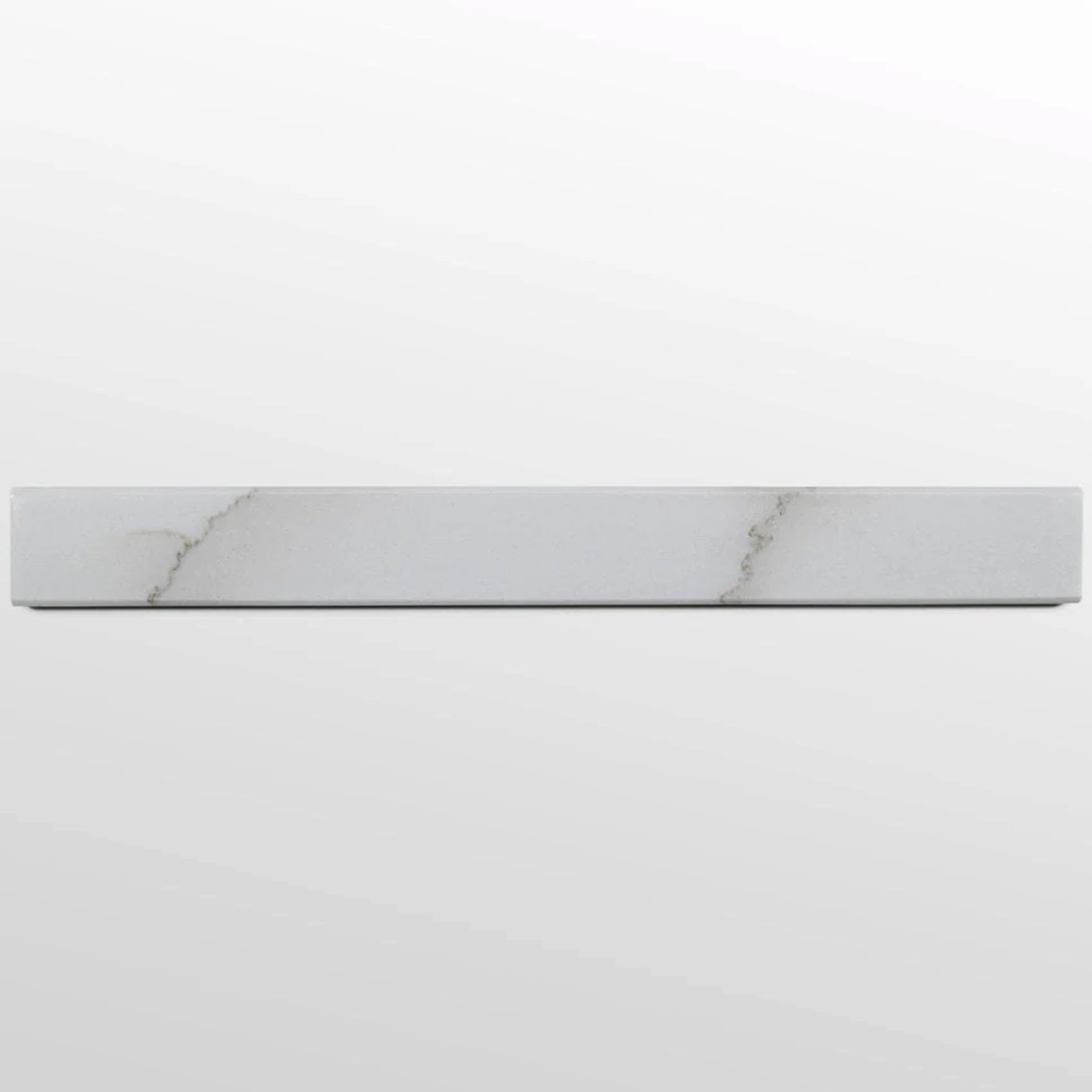 A long, narrow rectangular piece of Colorado Calacatta marble threshold, featuring subtle gray veining on a white surface, is shown against a plain, light gray background.