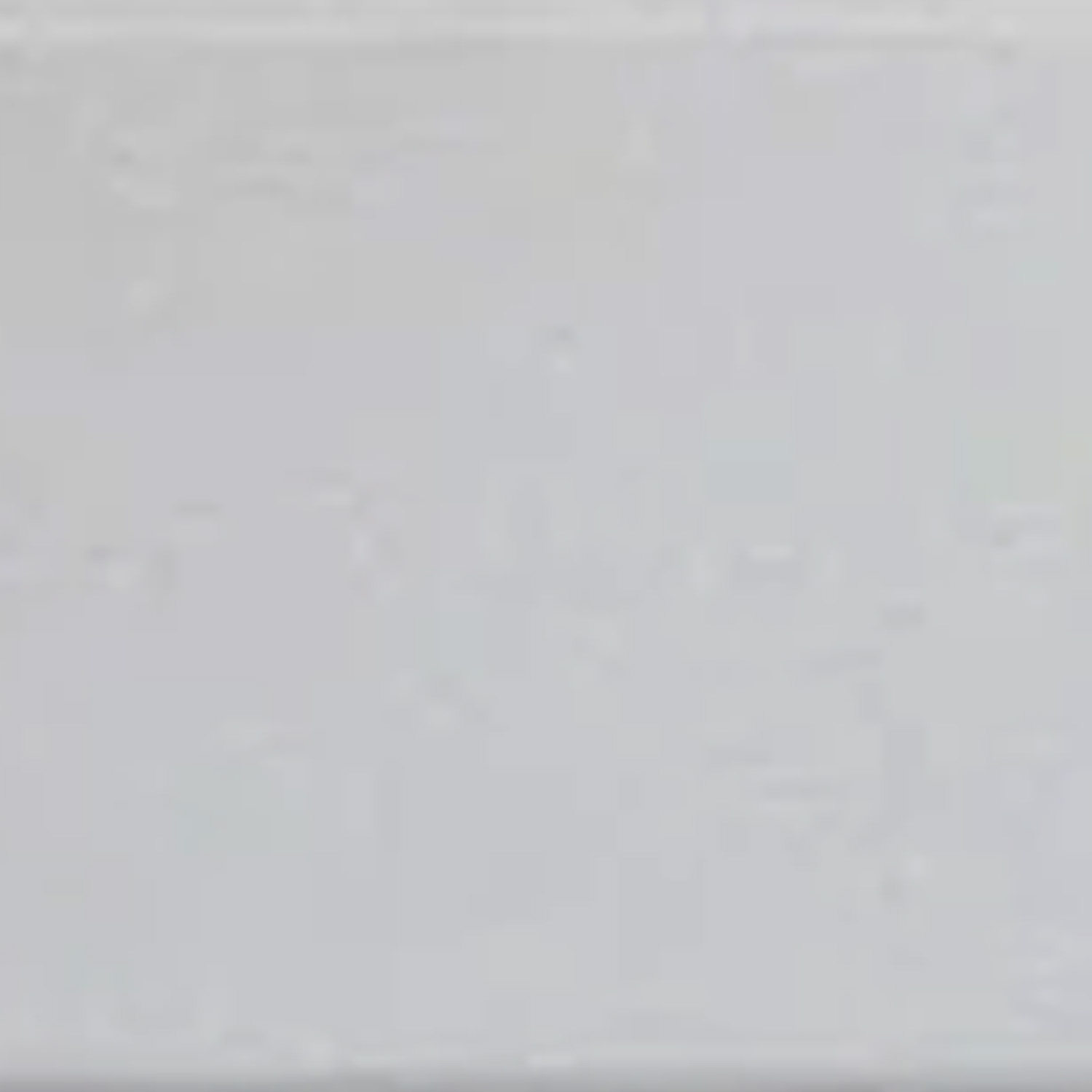 A close-up of the smooth, plain surface of Thresholds - Colorado Calacatta, light gray in color with no visible patterns or distinguishing features.
