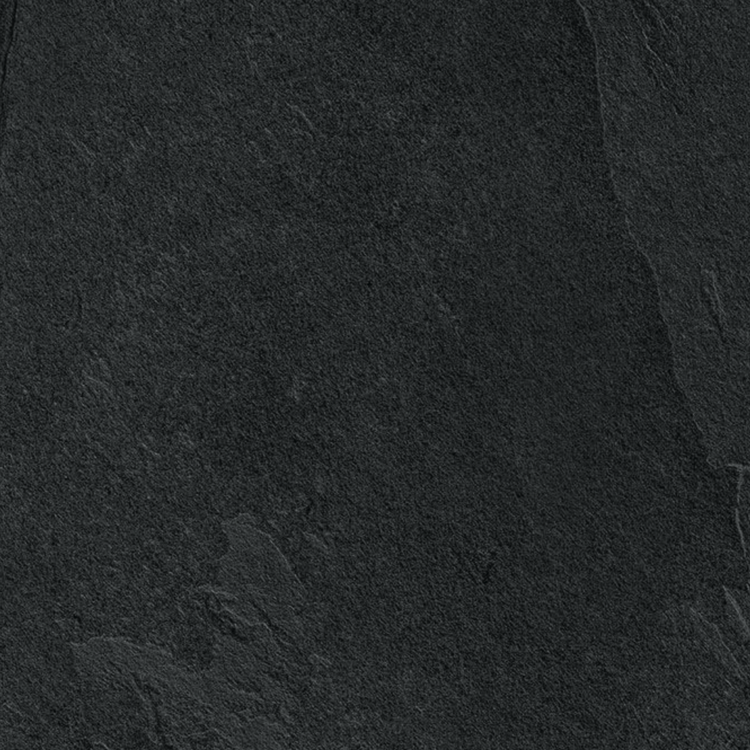 A close-up view of the Waterfall - Dark Flow surface, showcasing its dark, textured stone appearance with subtle shading variations and fine natural patterns.