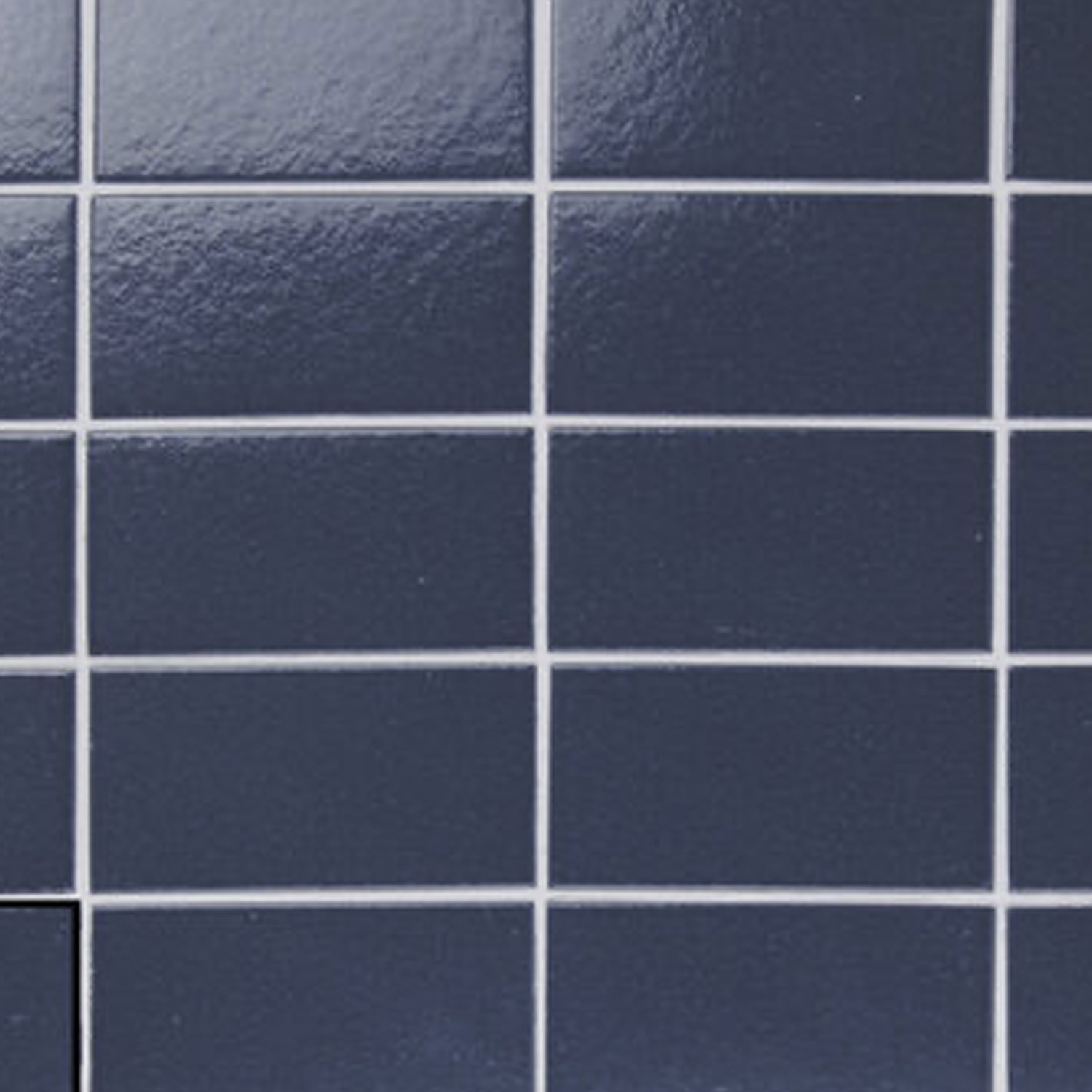 A grid of Arka - Arka Blue tiles with white grout lines, with one tile near the bottom left corner slightly out of alignment compared to the others.