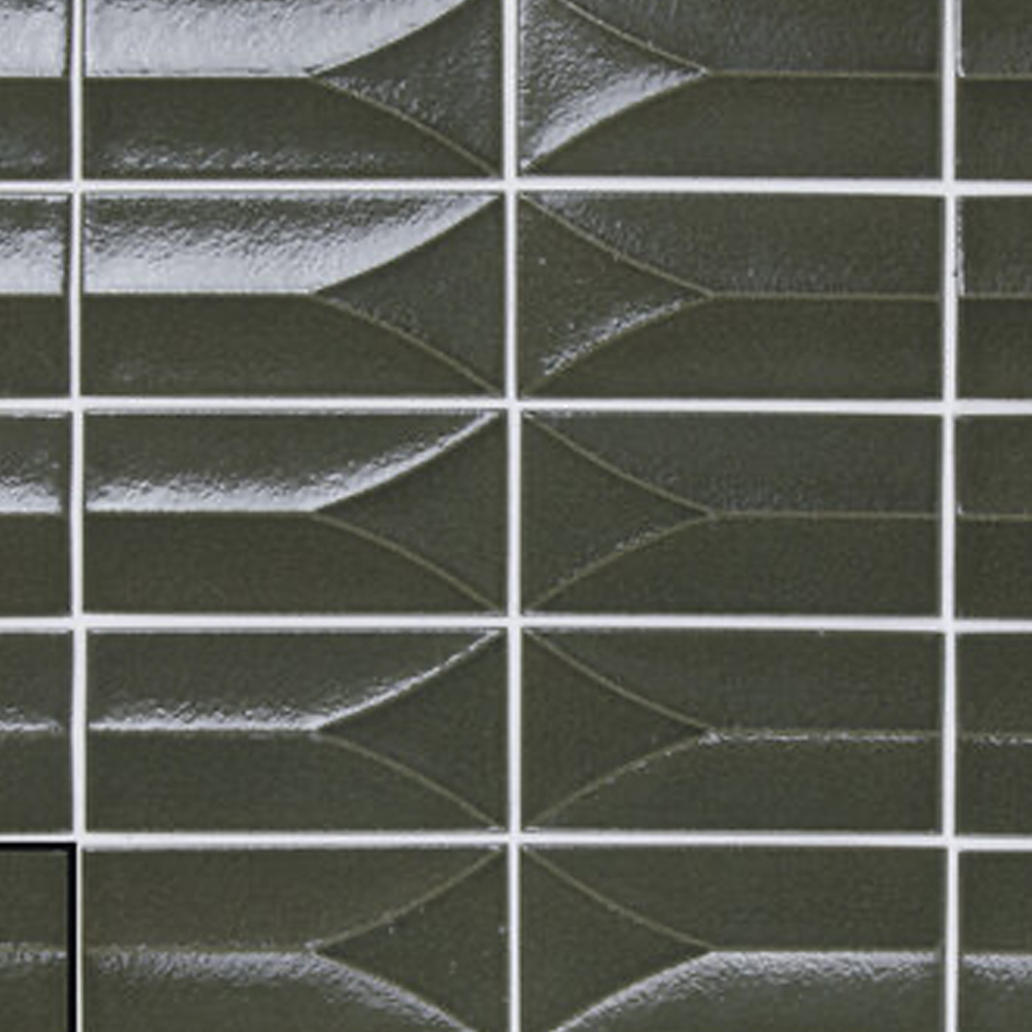 Arka - Forma Green tiles feature a glossy dark green finish and raised geometric patterns, forming a repeating design separated by thin white grout lines. These rectangular tiles create a modern and textured wall surface.