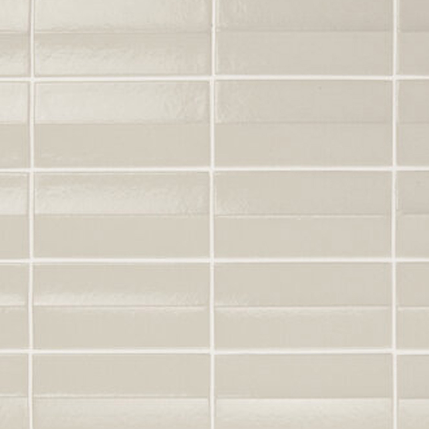 A close-up view of Arka - Ona Bone tiles showcases their light beige, glossy rectangular form arranged in a stacked bond pattern and separated by thin, clean white grout lines. Each tile features a subtle, molded horizontal ridge that adds a textured, dimensional effect.