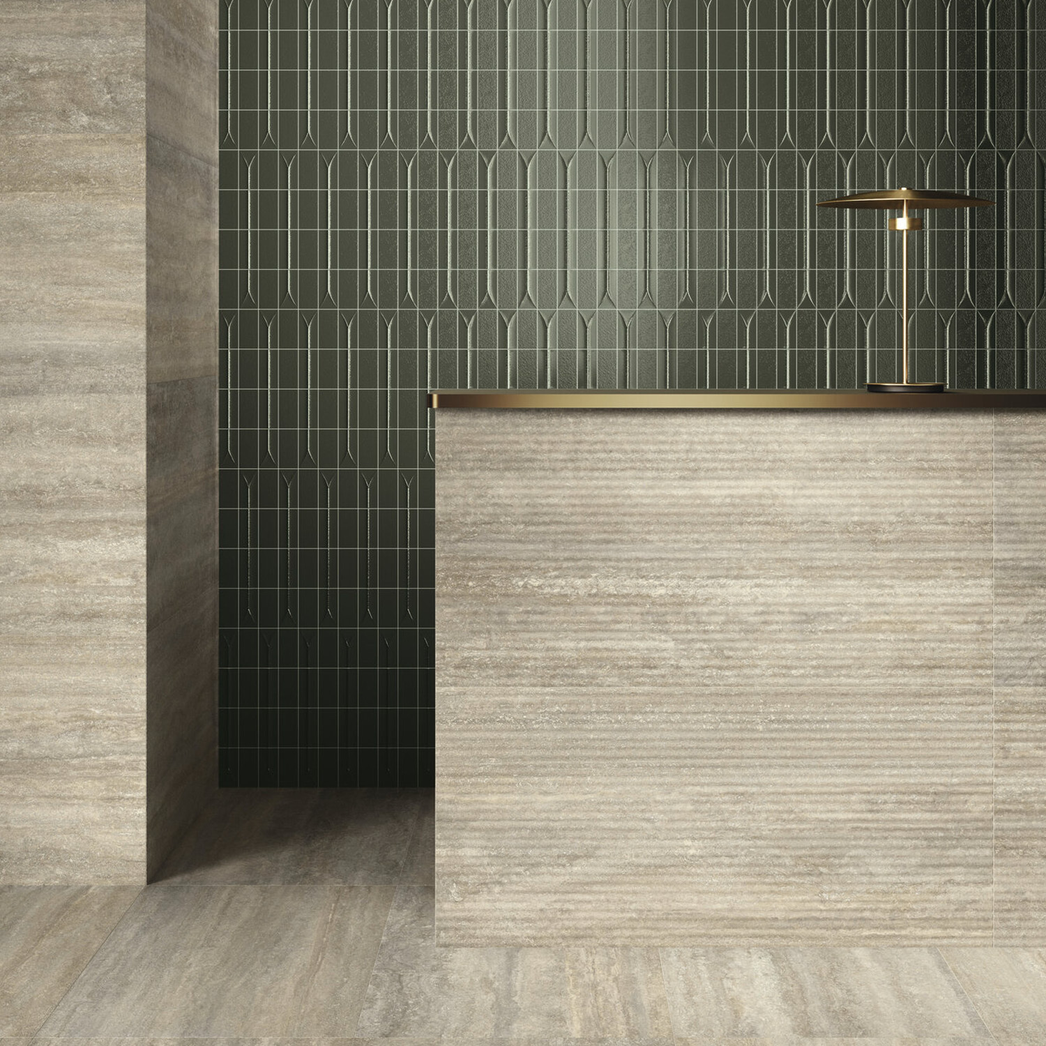 Modern minimalist interior with a stone reception desk, matching stone flooring and wall, and a dark geometric tiled accent wall. The Arka - Ona Green brass table lamp sits elegantly on the desk’s surface.