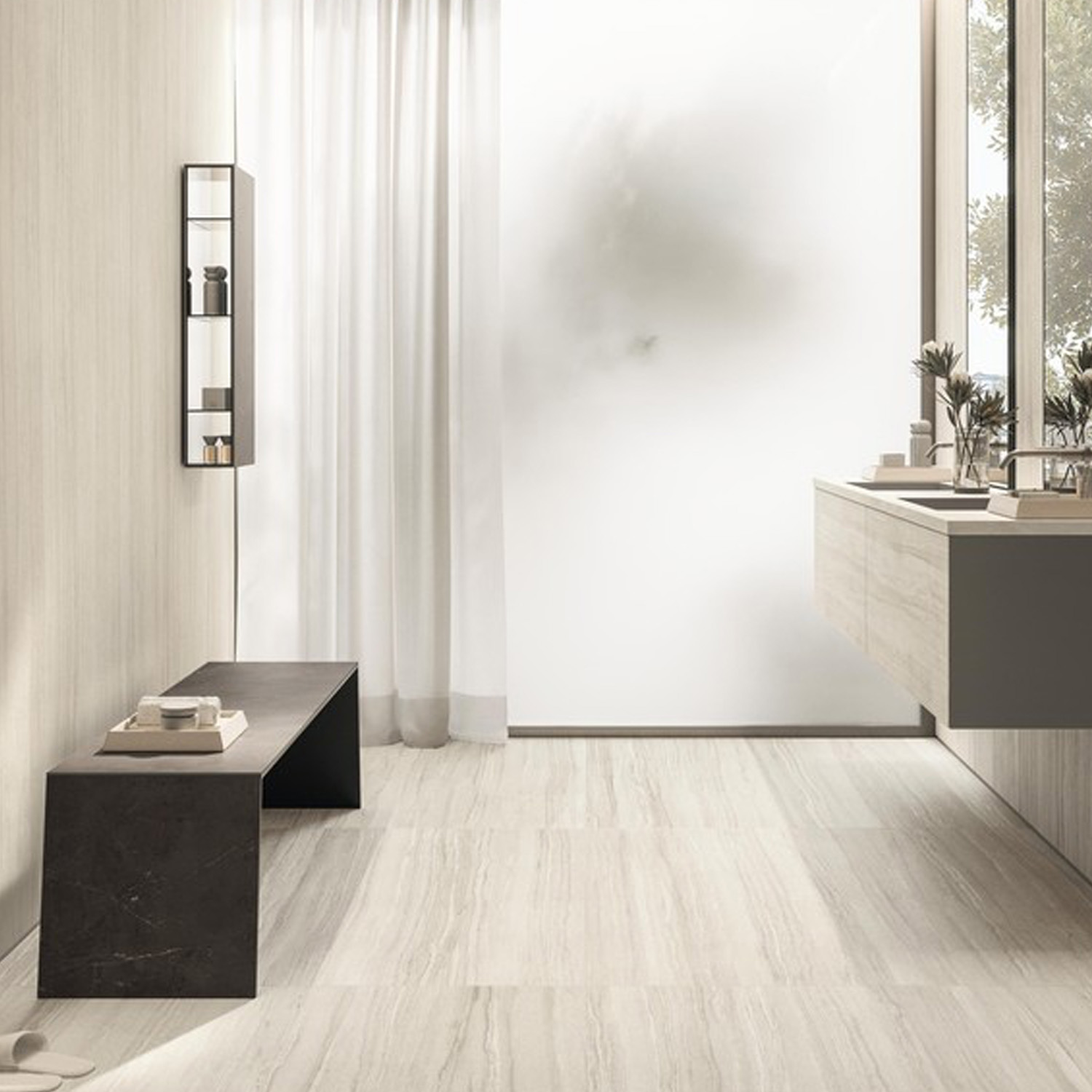 Minimalist bathroom with Marvel T - Stone Veil floors, a black bench, wall-mounted shelving, light-colored vanity, white curtains, and a frosted window letting in natural light.