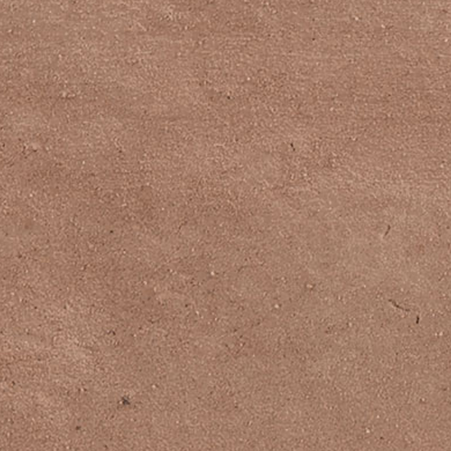 A close-up texture shot of Tyrrhenia - Clay reveals a matte, solid surface in an earthy terracotta hue, featuring a subtly rough, granular, and uniform appearance.