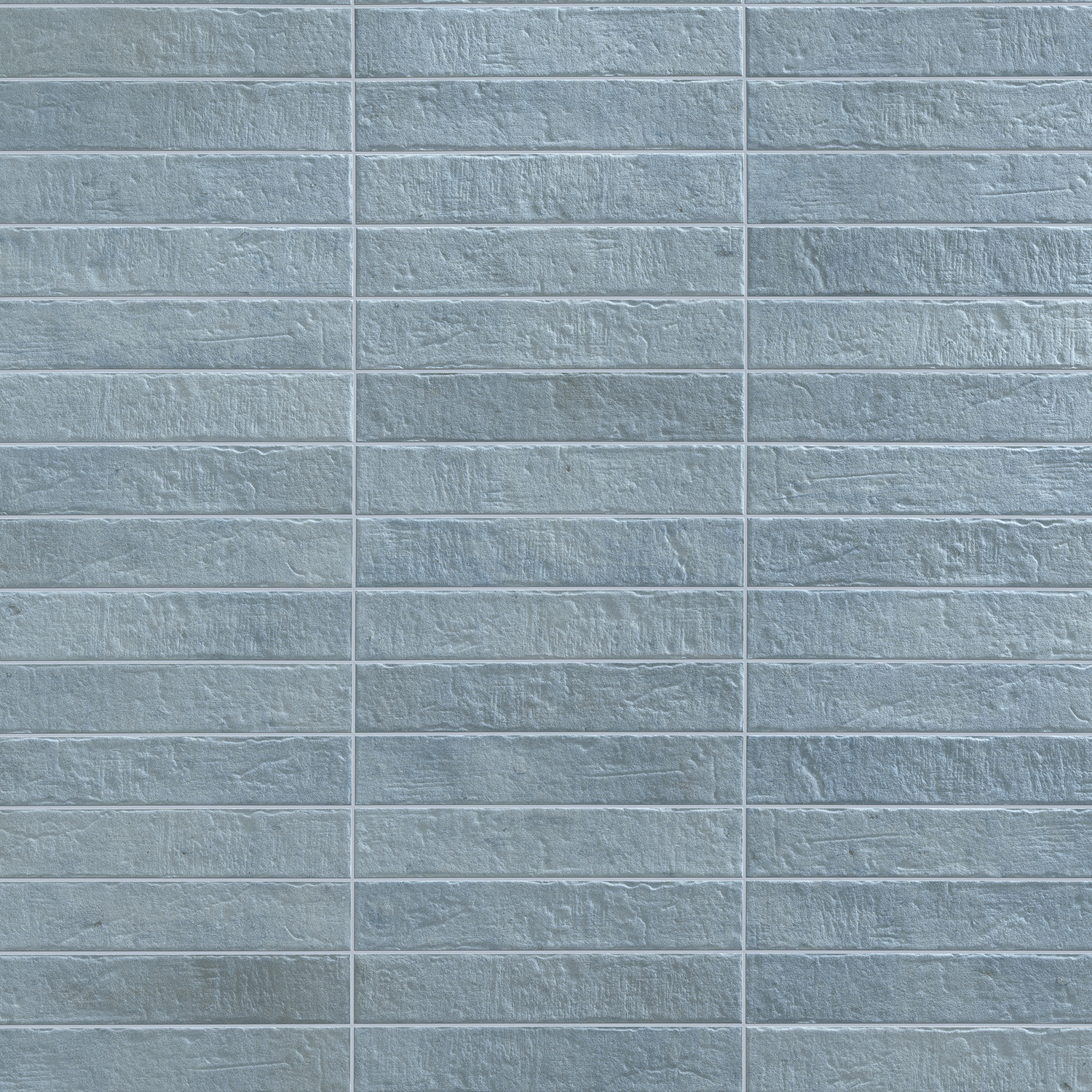 Tyrrhenia - Navy features a textured brick wall pattern with horizontal and vertical grout lines forming a precise grid. Each brick displays a rough, stone-like surface and is evenly arranged in rows and columns.