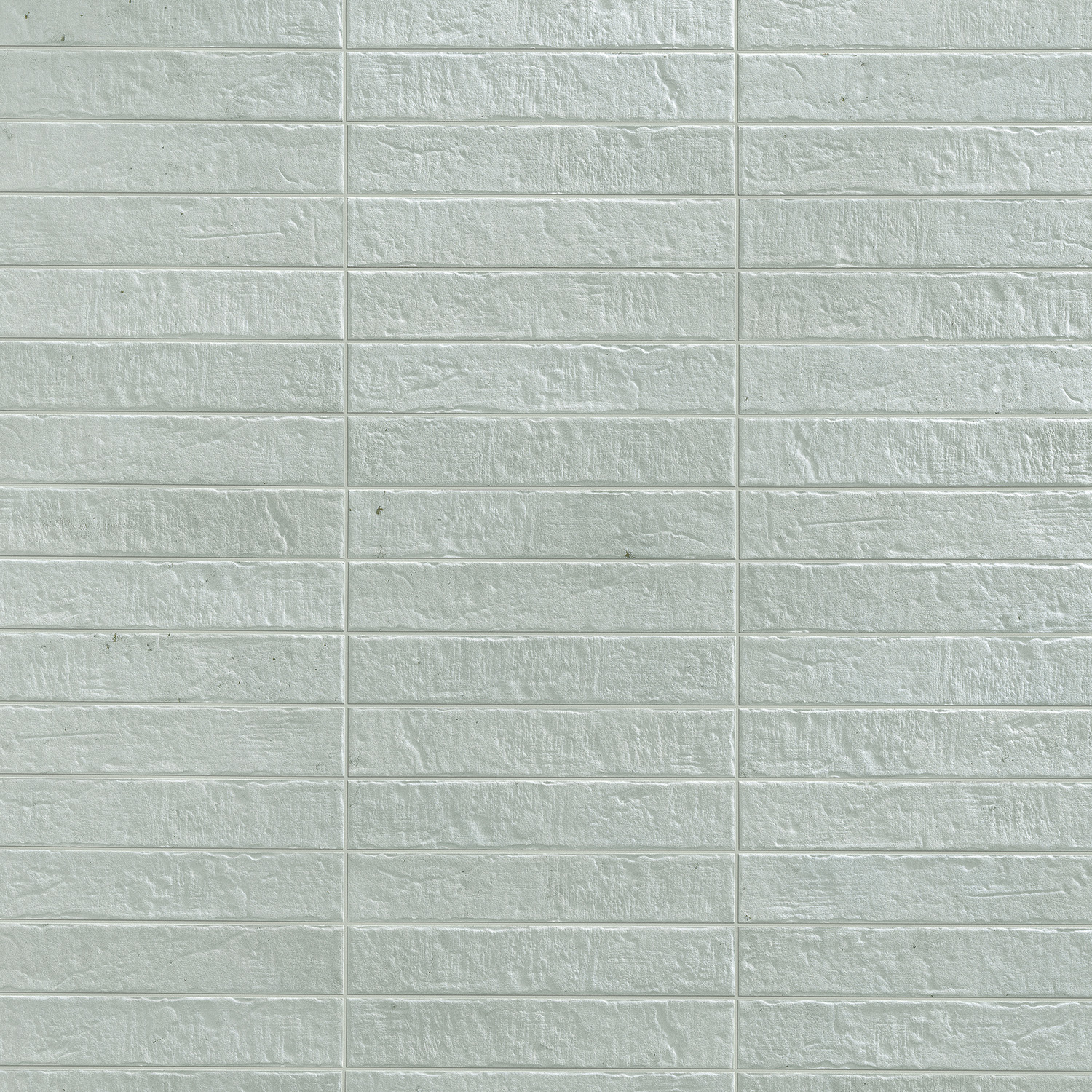 Tyrrhenia - Sage features a light gray textured wall design with a grid pattern of horizontal and vertical lines, resembling rectangular stone or brick tiles.