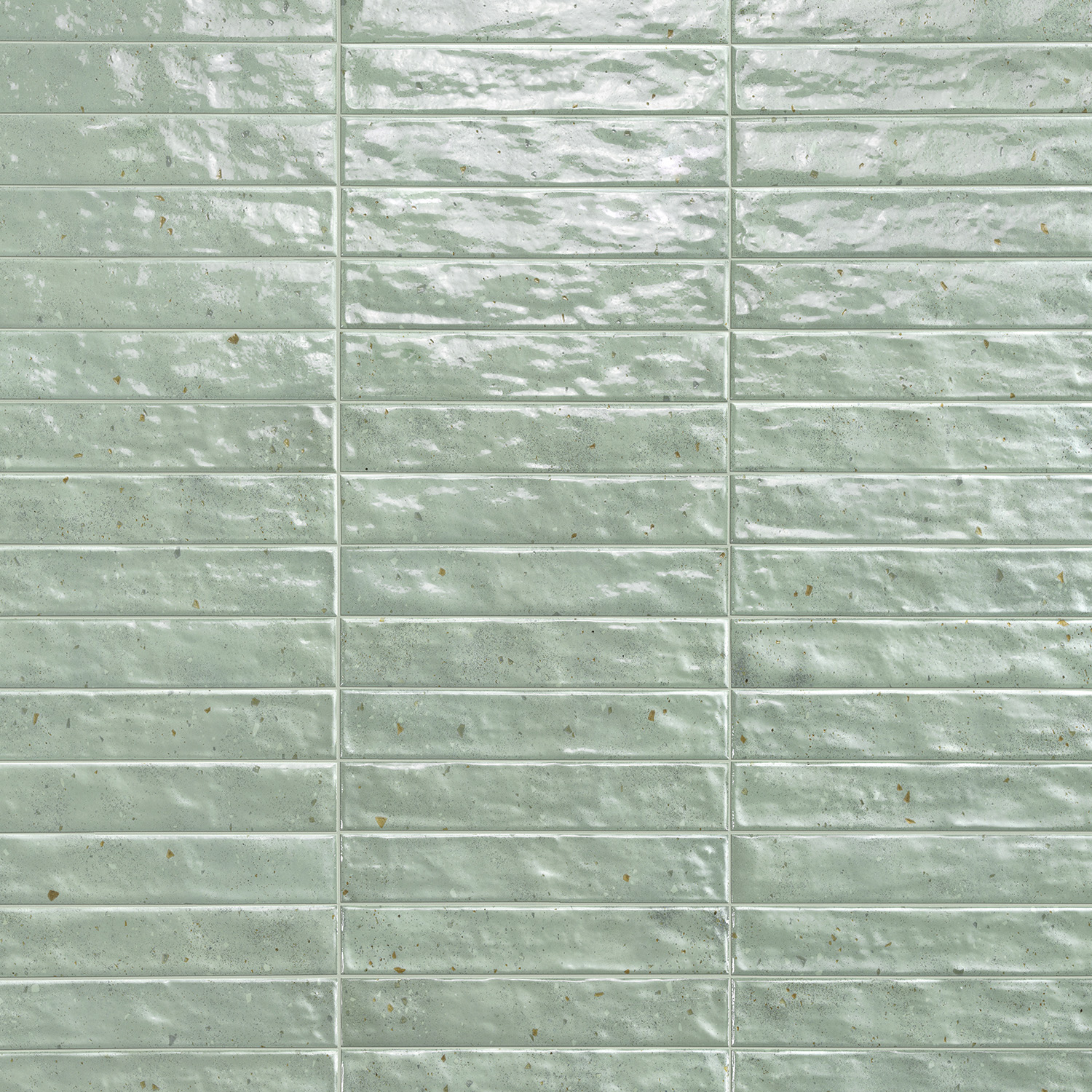 Via Del Sale - Green tiles feature a light green hue and a rectangular shape, arranged in a grid pattern with visible grout lines and a textured, slightly glossy surface.